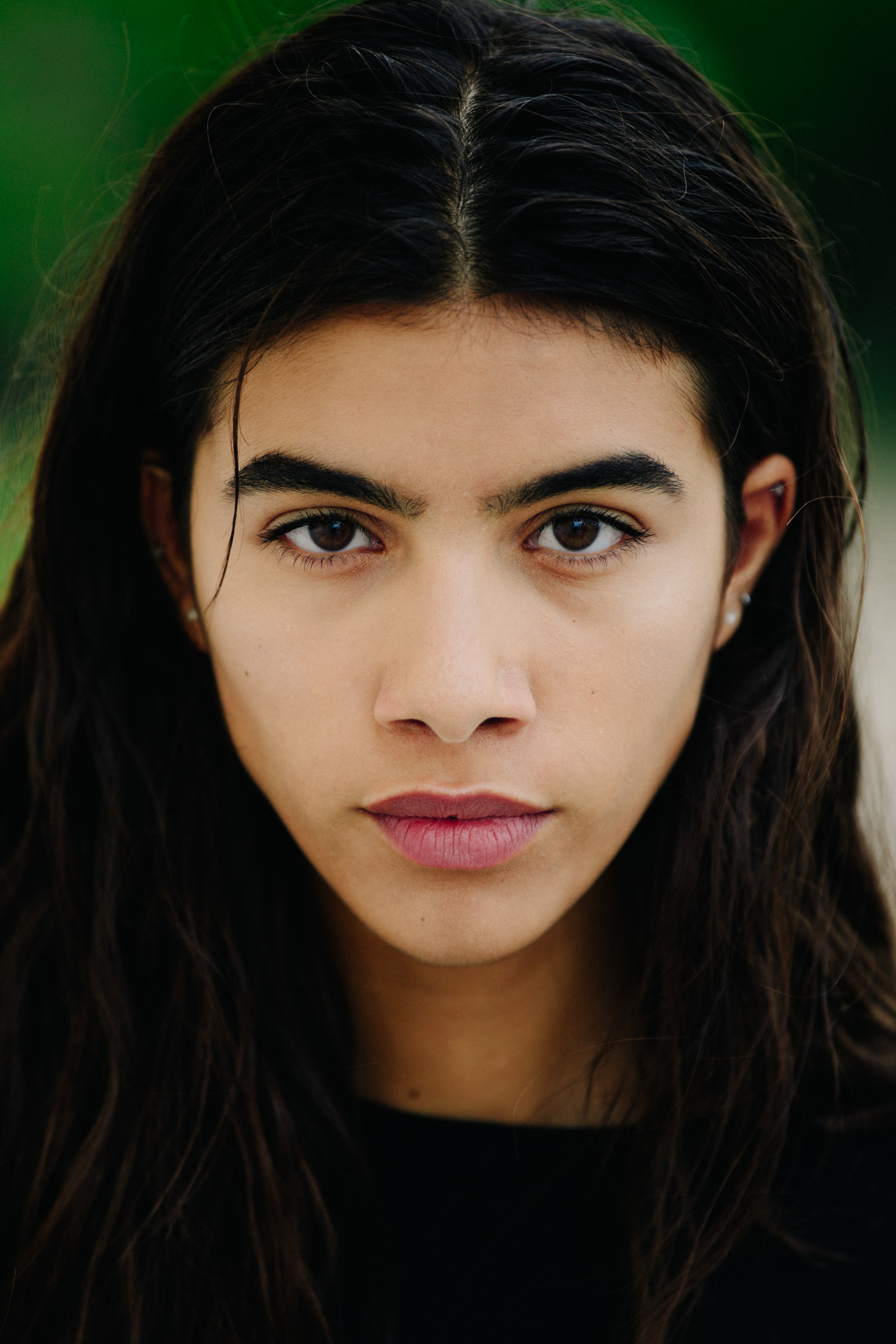 Portrait of model with thick black hair