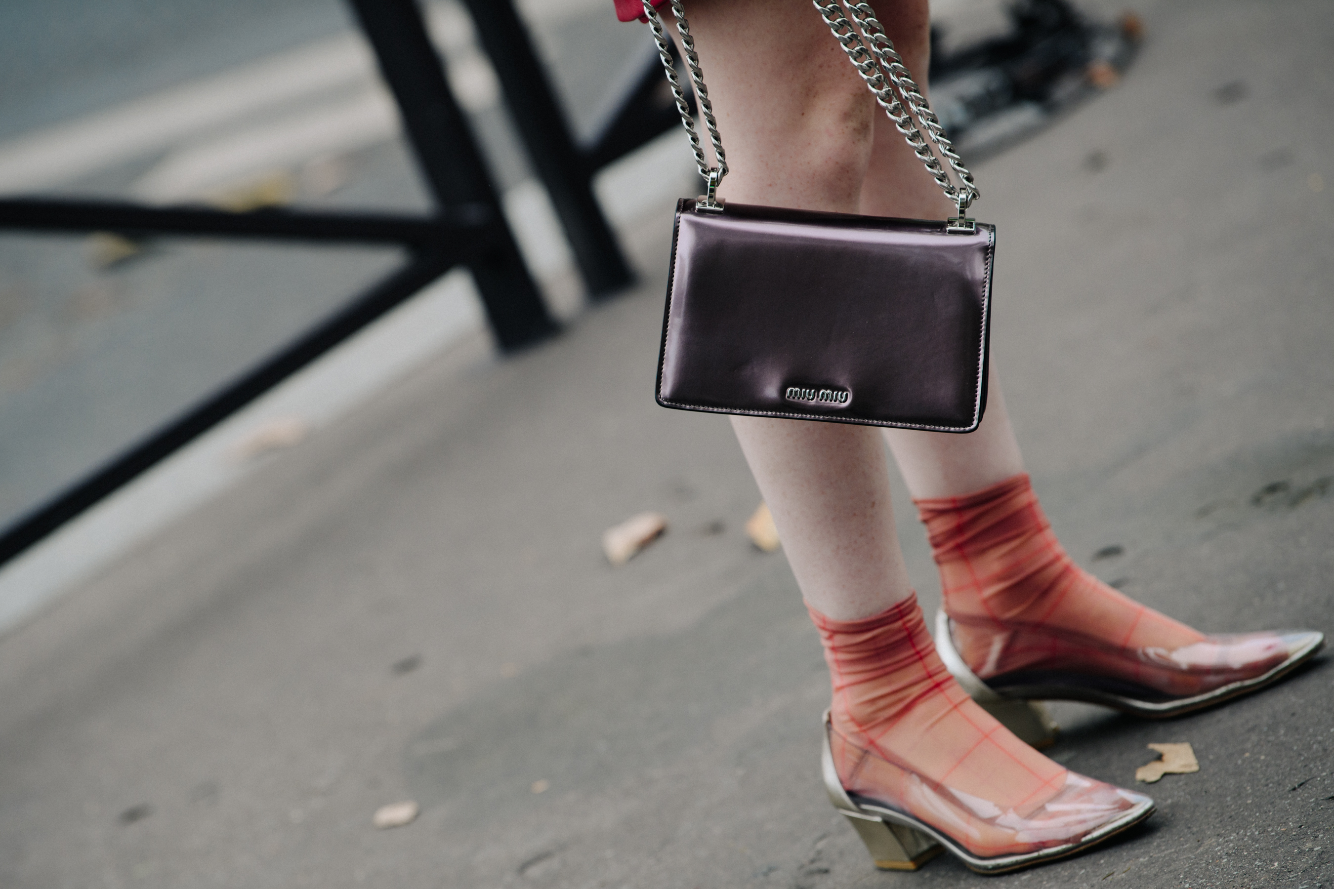 Woman carrying Miu Miu bag