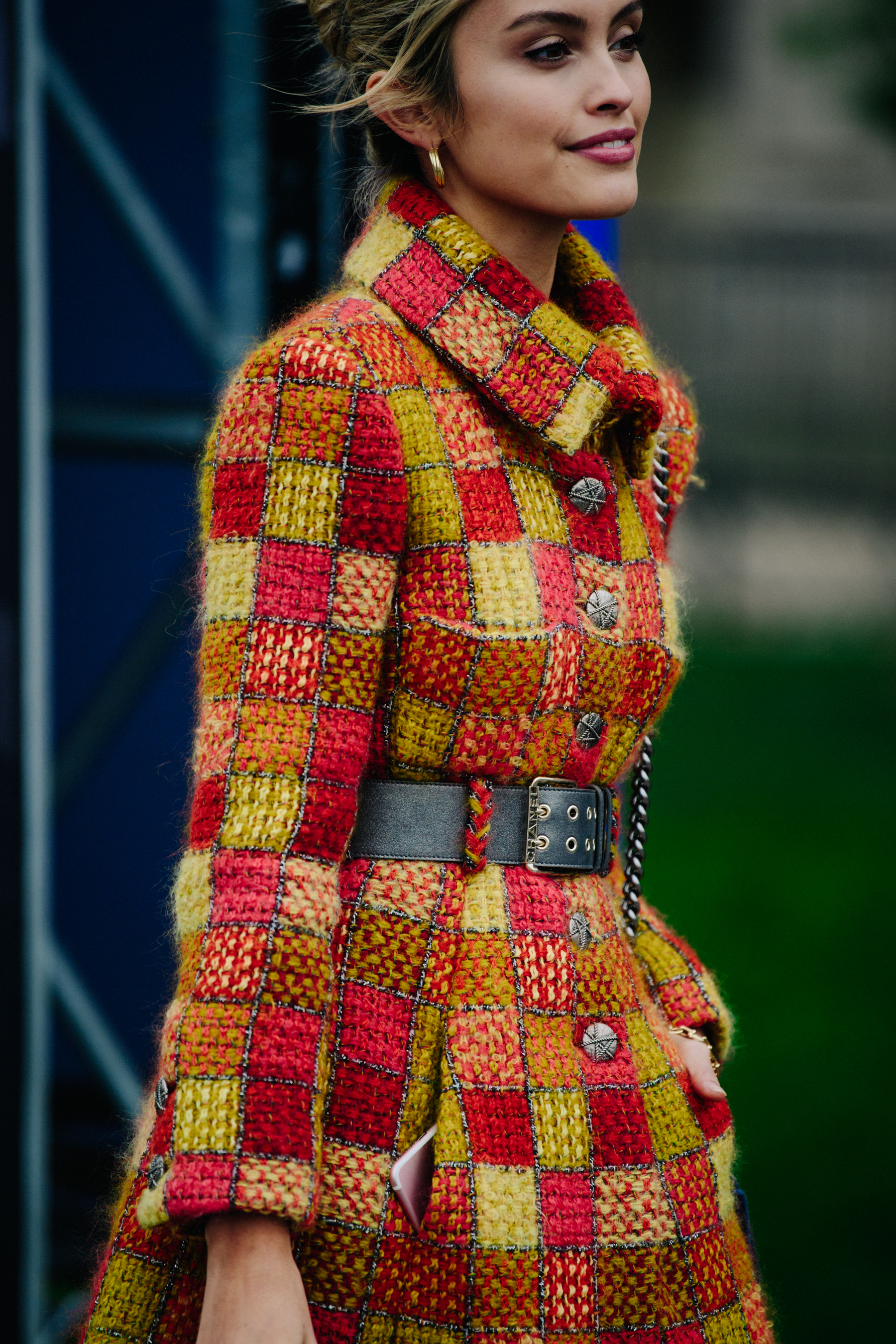 Blogger wearing yellow and orange coat