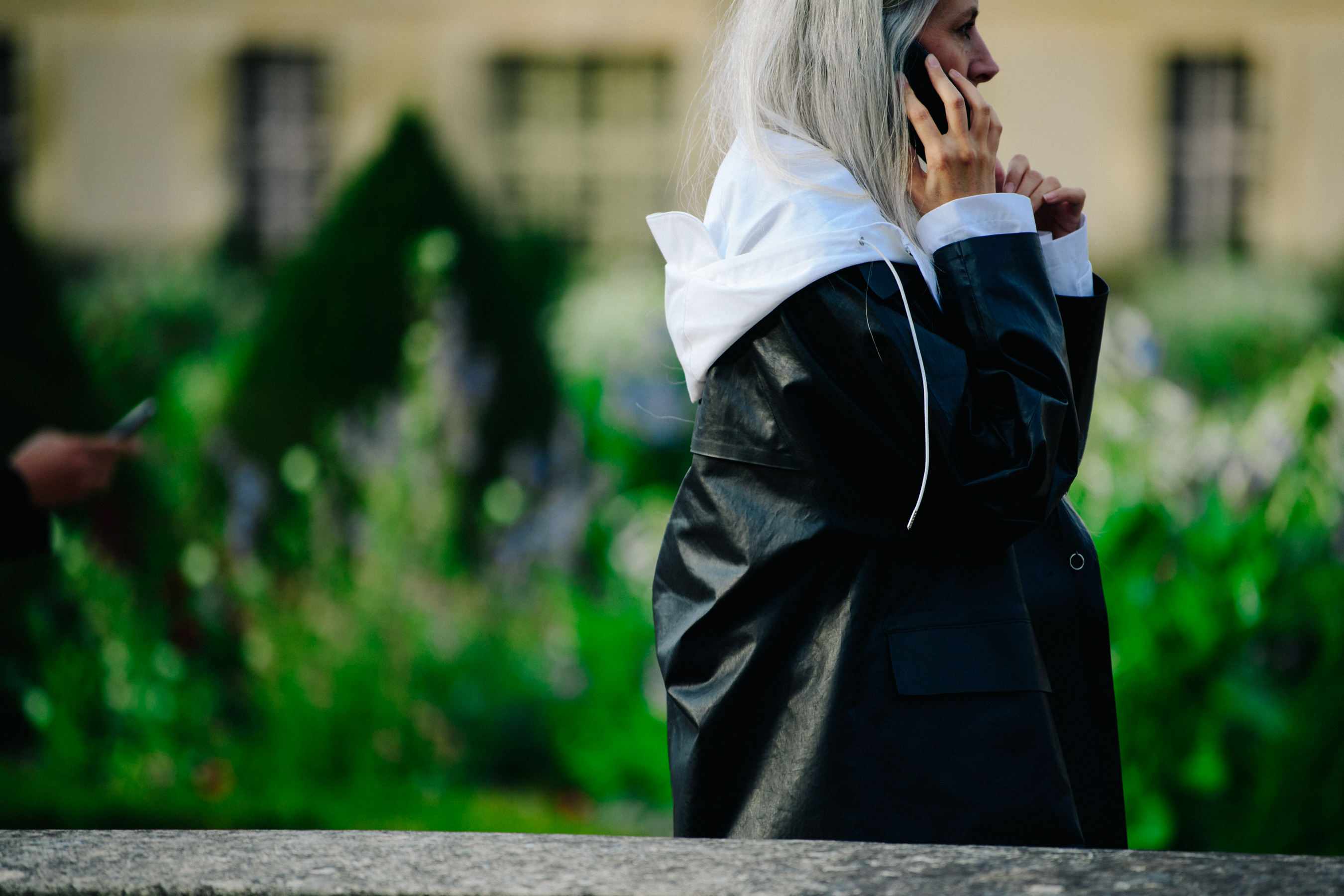 British editor wearing black coat