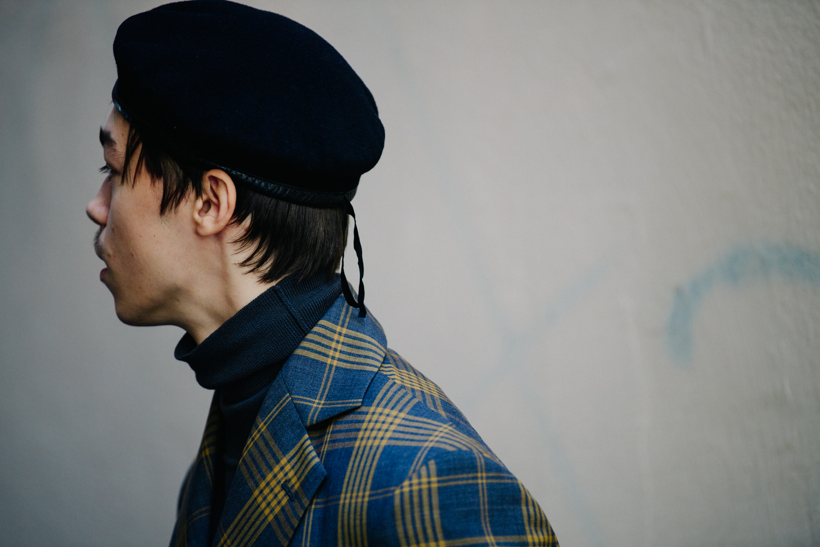Model wearing black beret