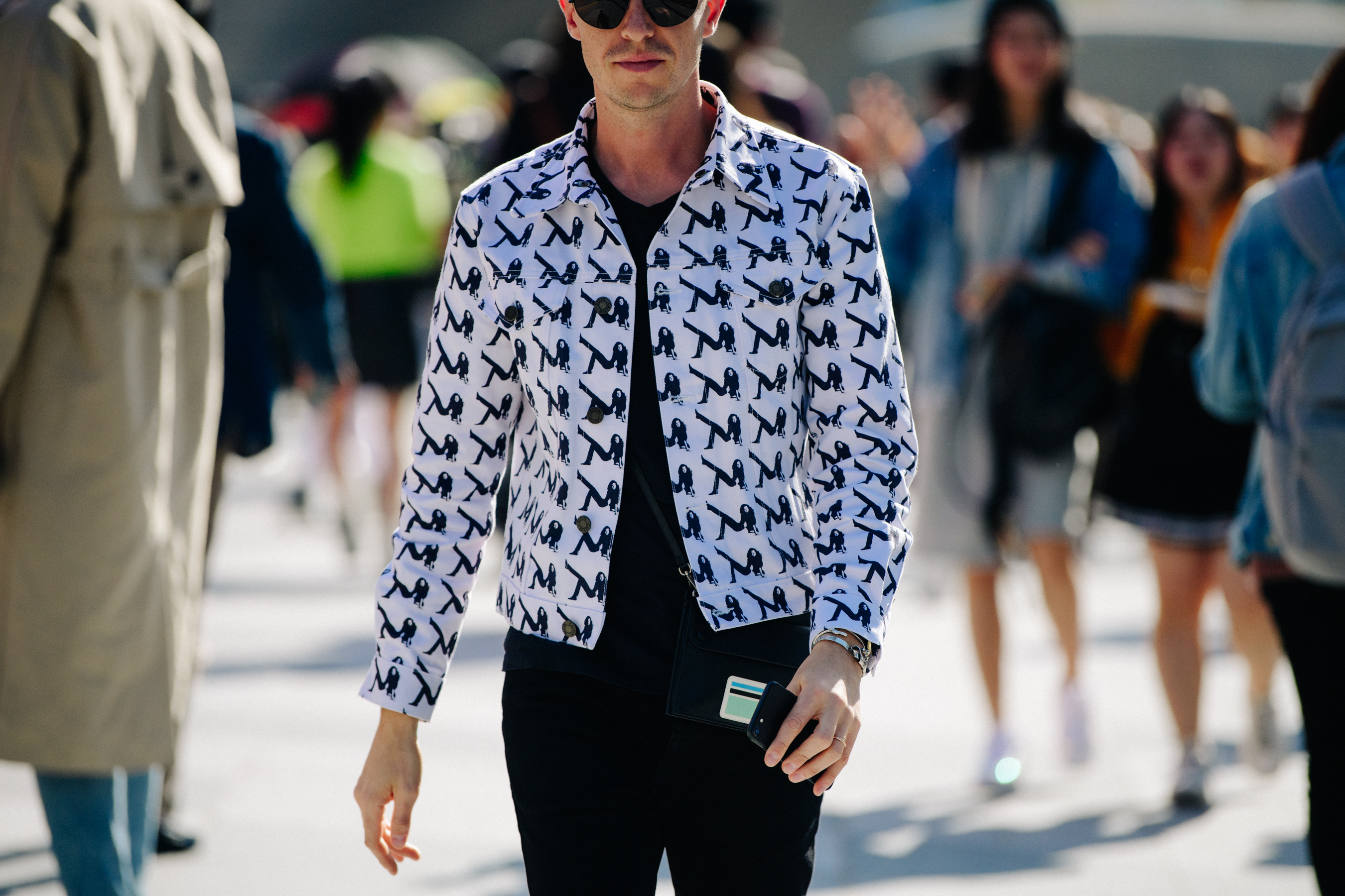 Man wearing white denim jacket