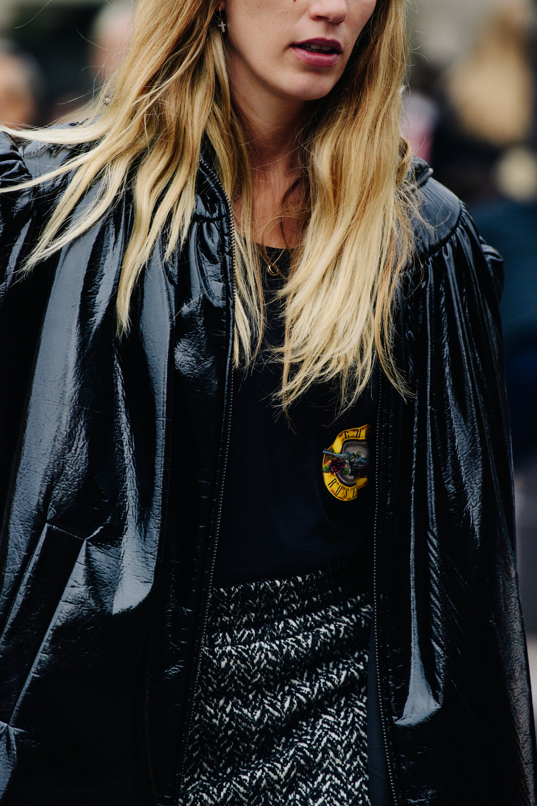 Woman wearing black plastic coat
