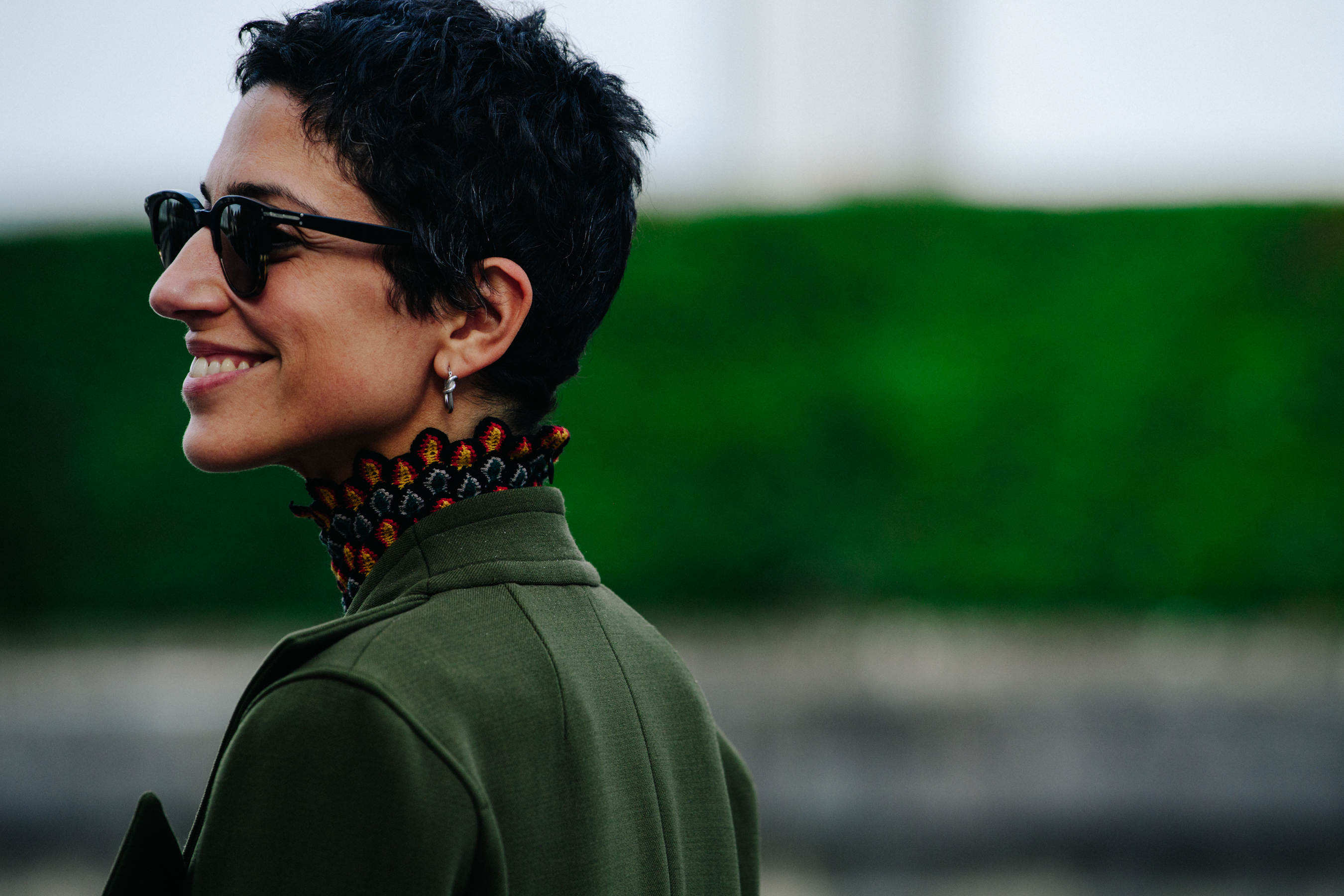 Woman wearing long green coat