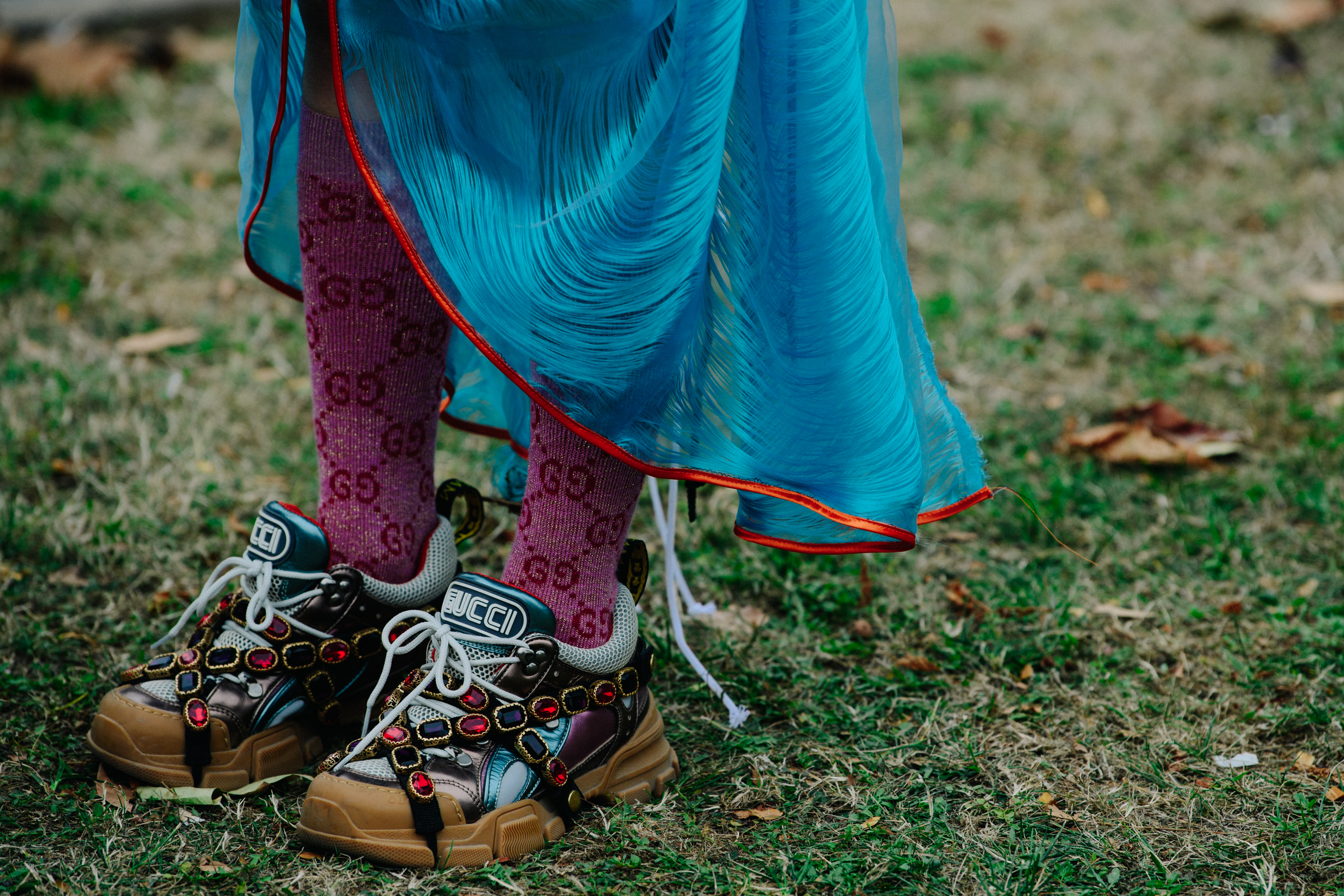 Woman wearing Gucci sneakers