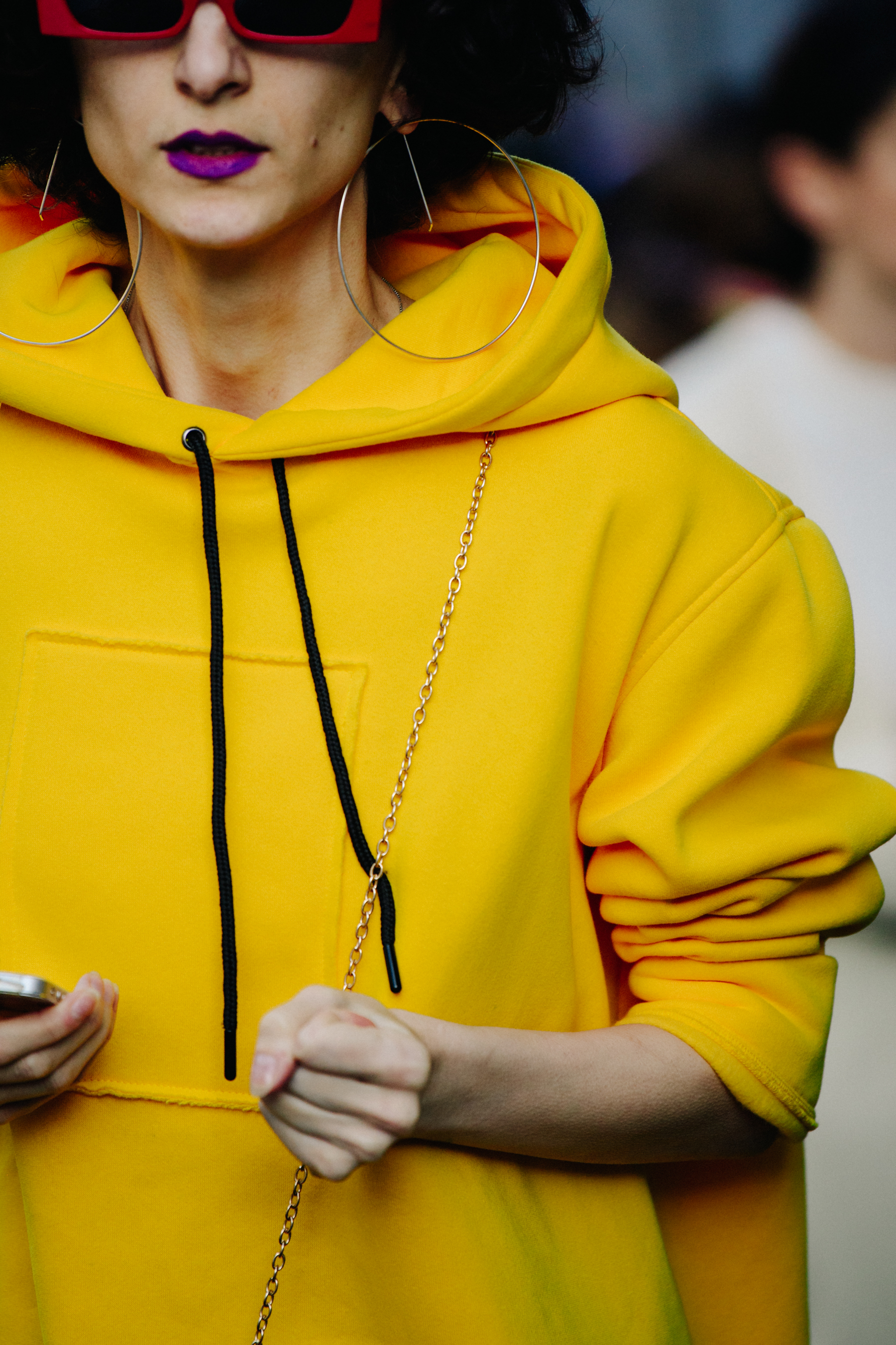 Woman wearing yellow hoodie