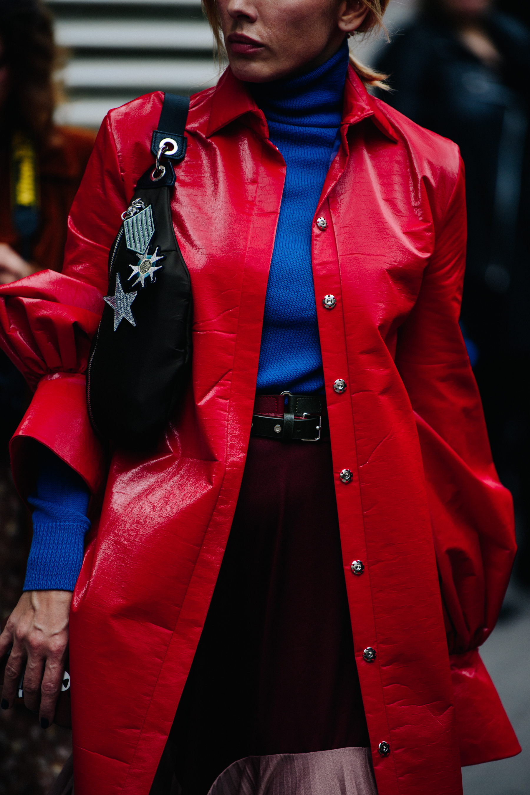 Woman wearing red leather coat