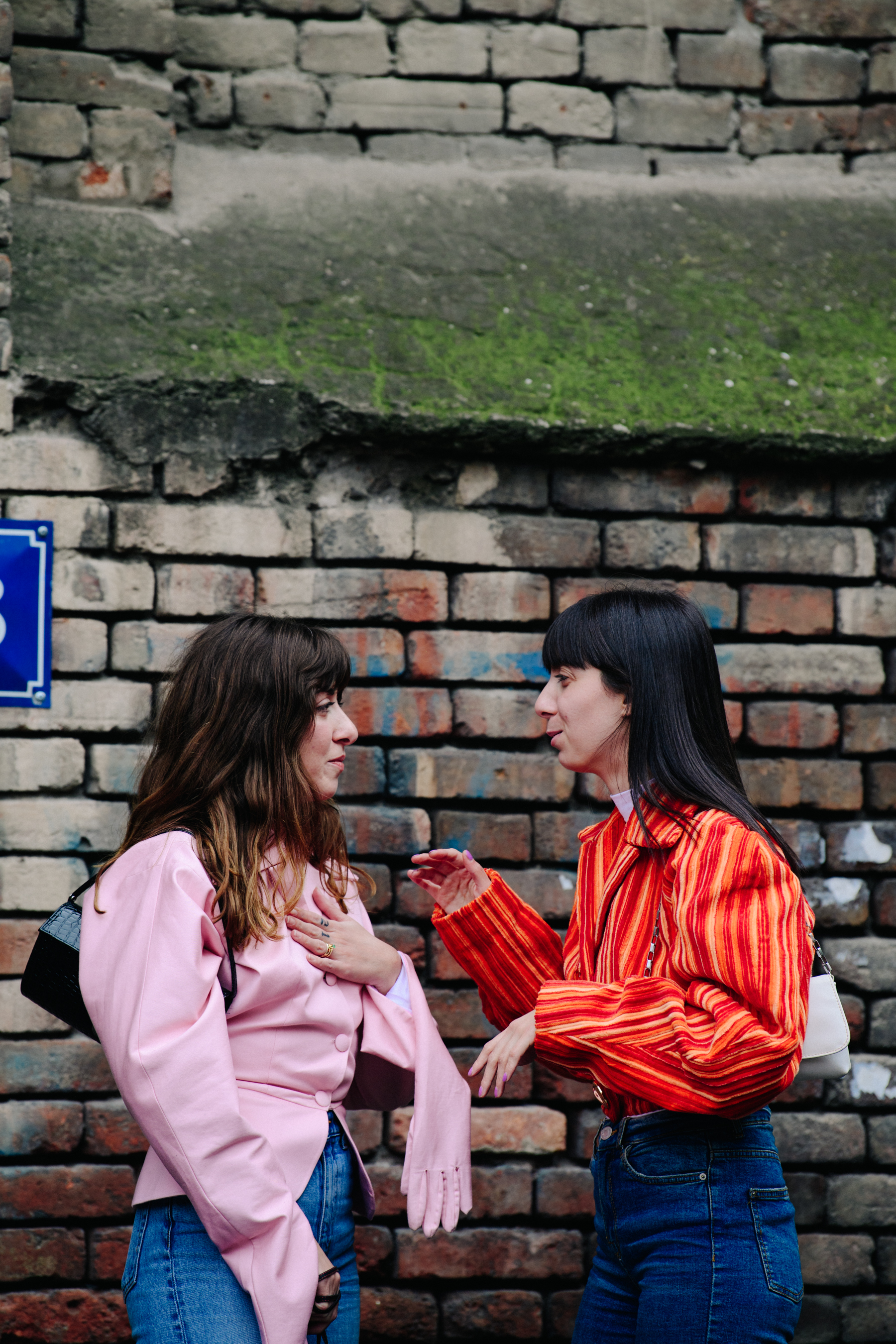 Two women wearing bright jackets