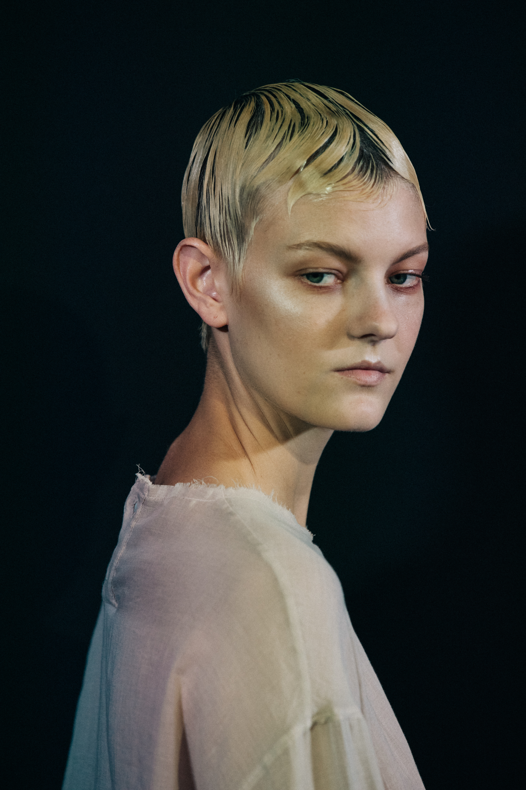 Model wearing white outfit at Ann Demeulemeester