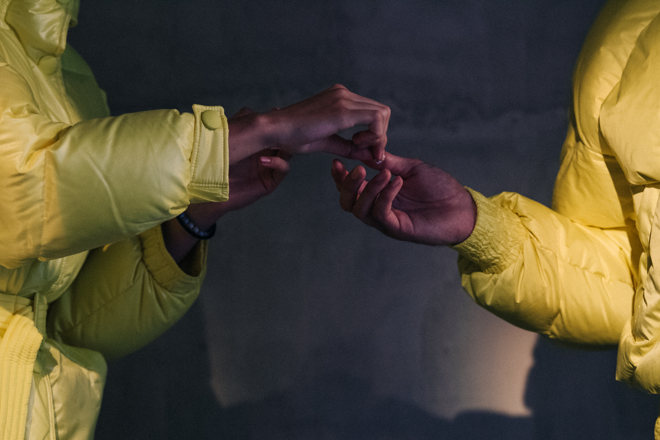 Models wearing yellow lenki lenki coats