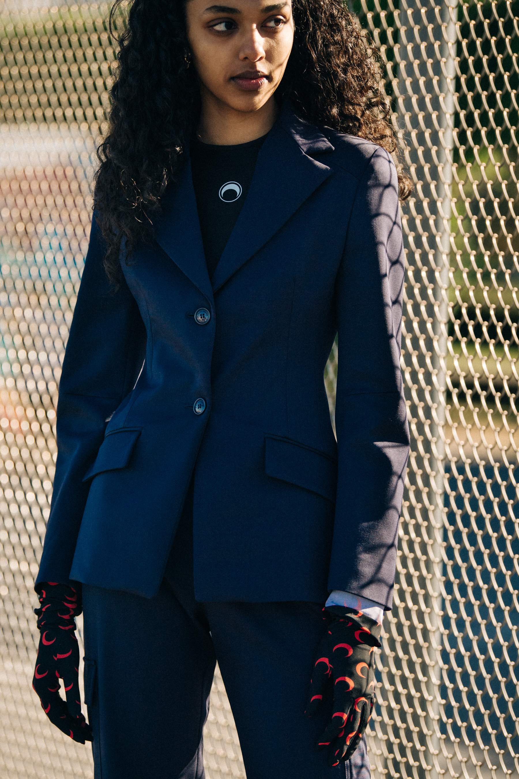 Model wearing dark suit at Marine Serre