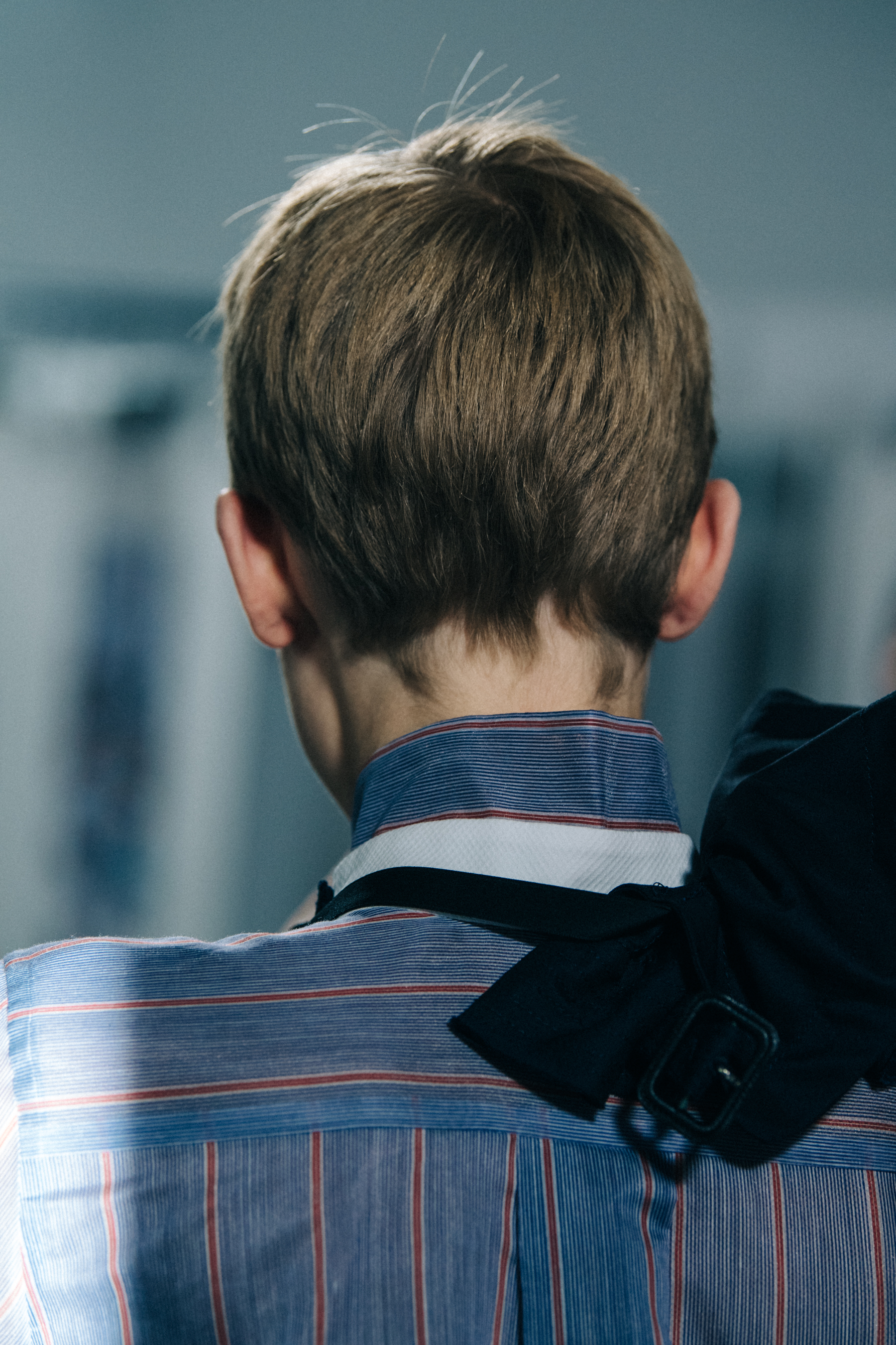 Models wearing colourful Sacai outfits backstage
