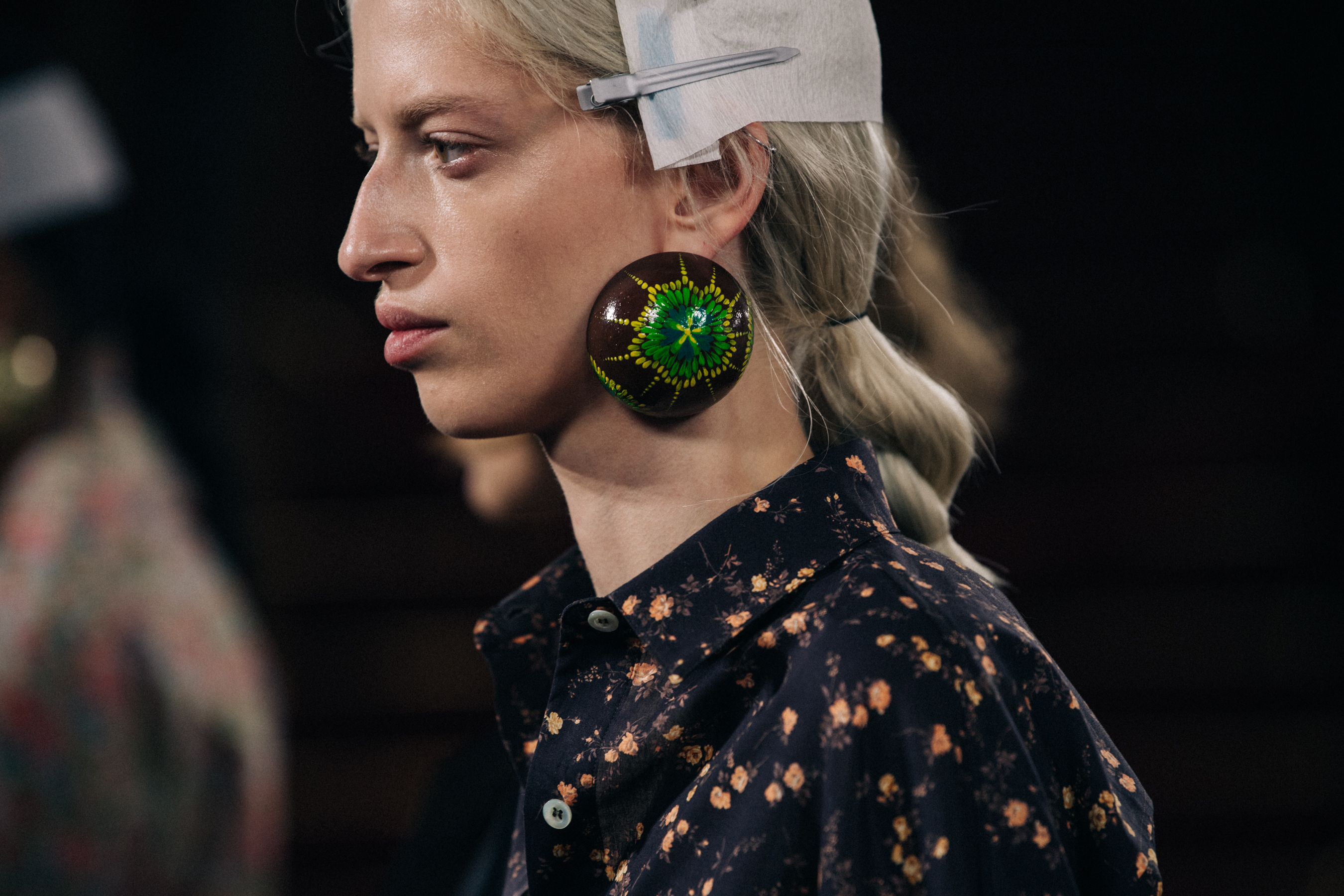 Model wearing large earrings at Y/Project
