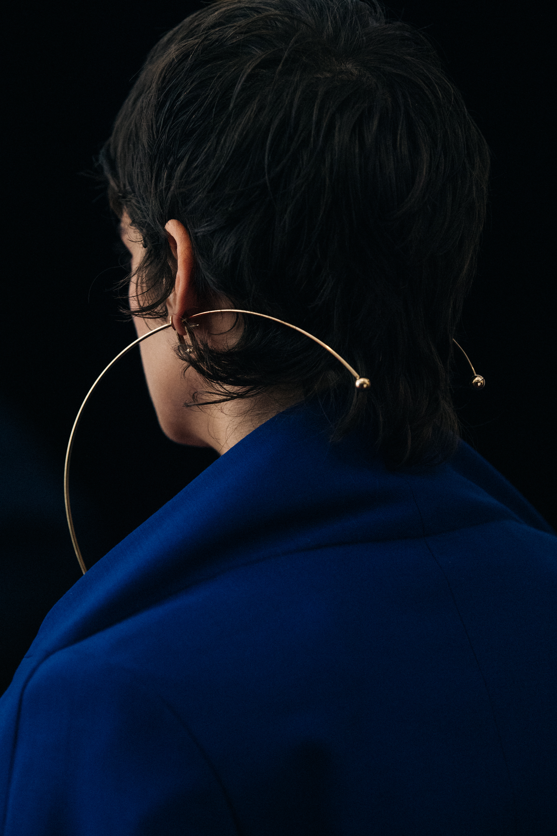 Model wearing large earrings at Y/Project
