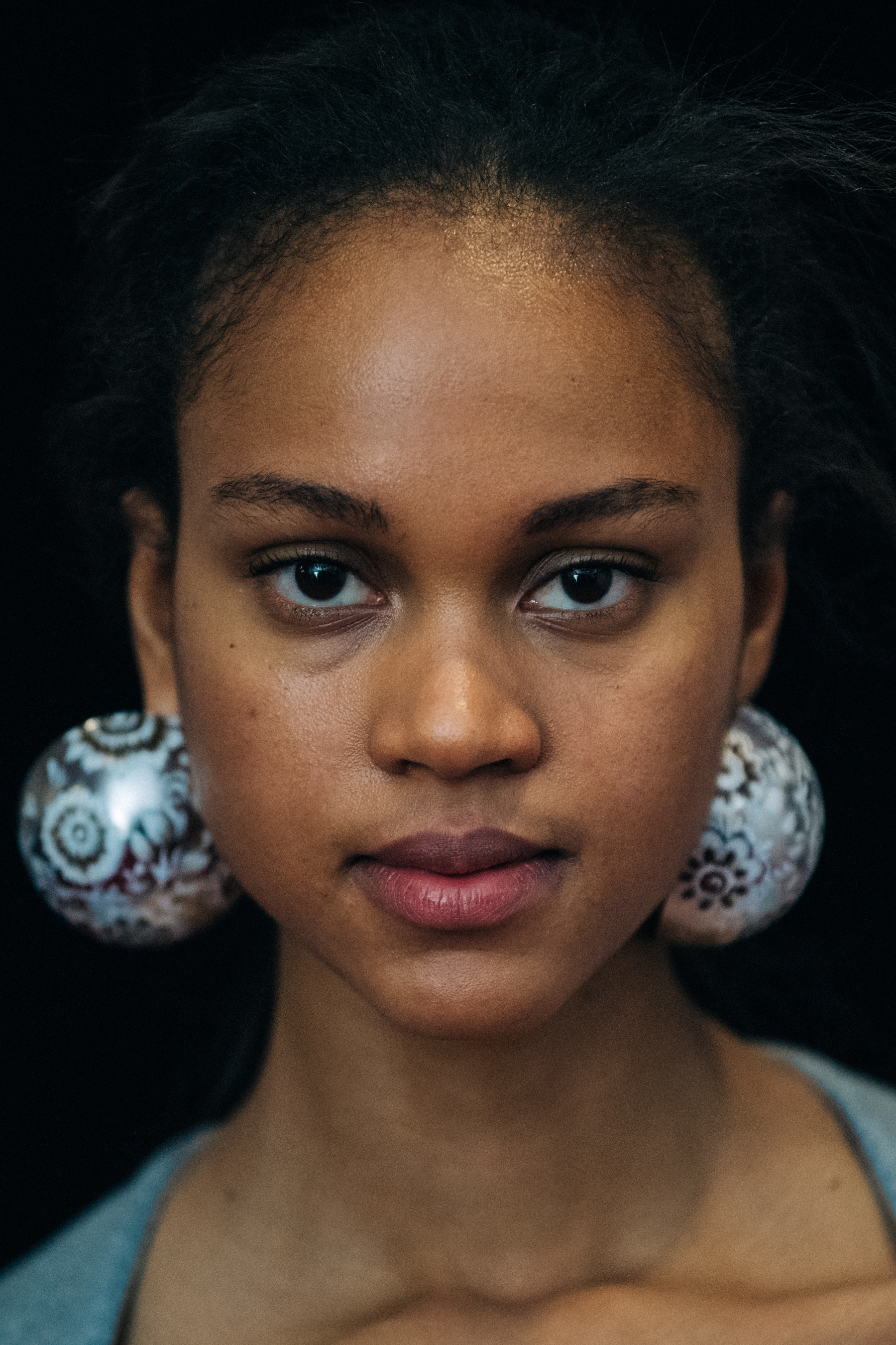 Portrait of model wearing large earrings