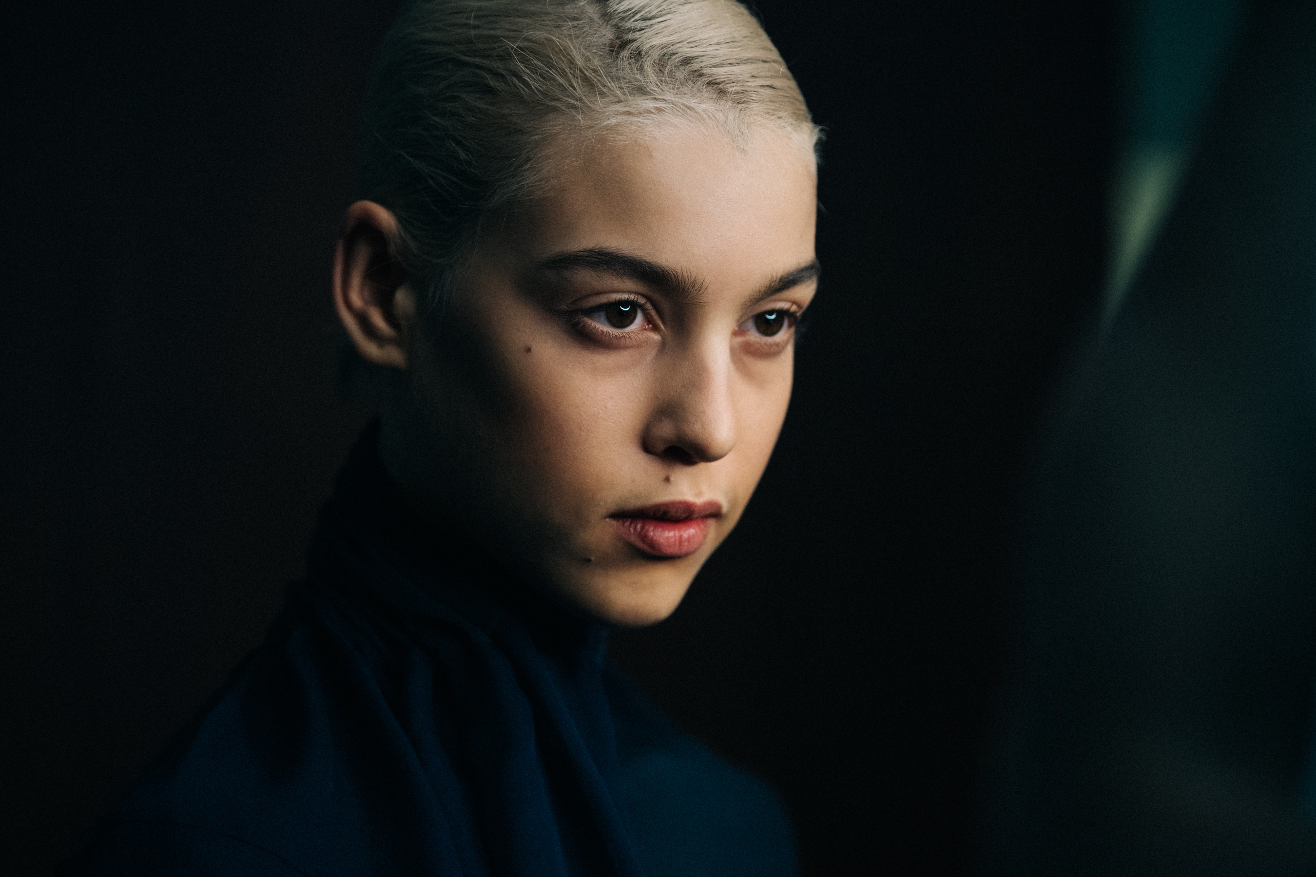 Model with slick blonde hair at Y/Project