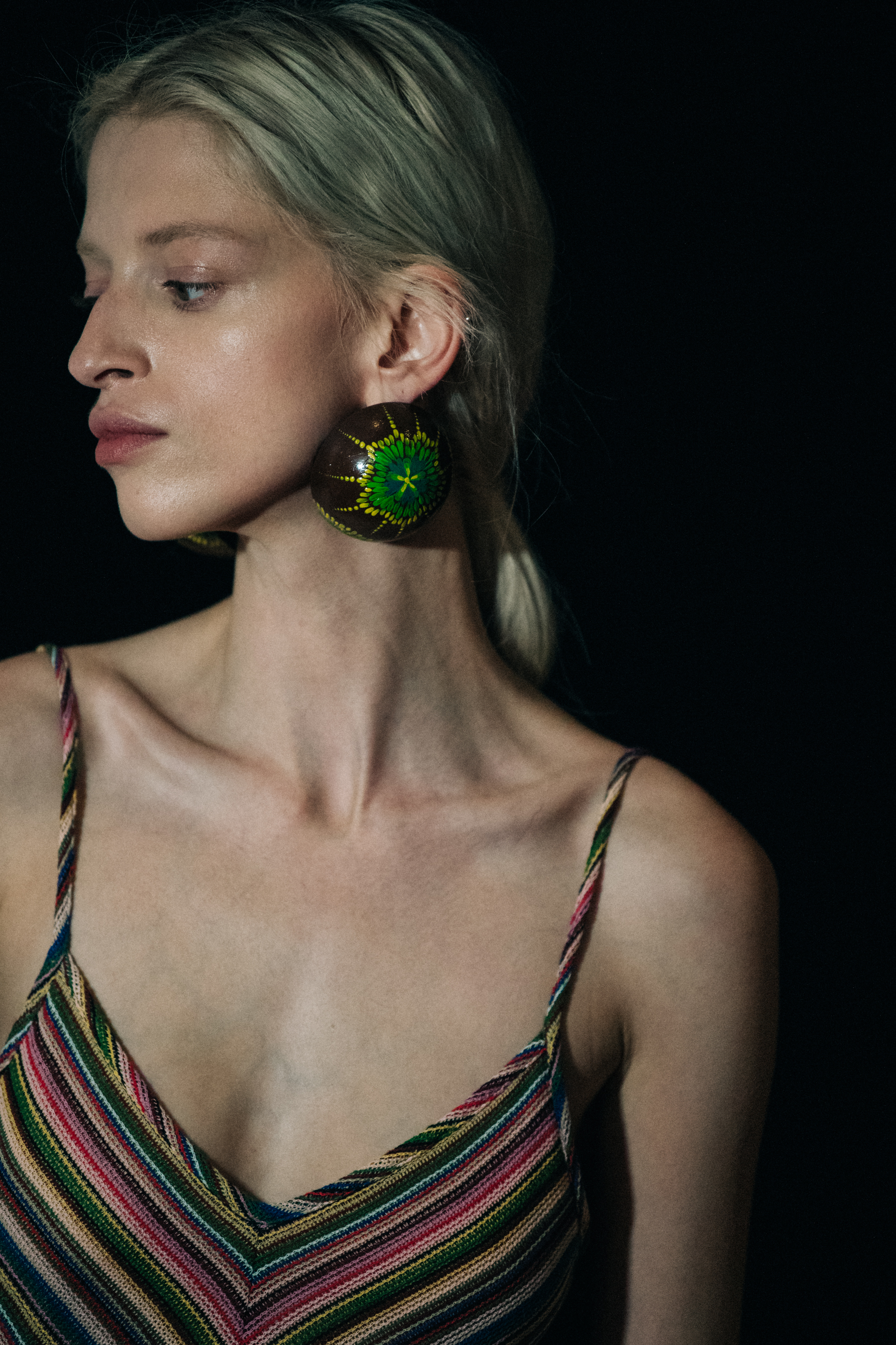 Model wearing large earrings at Y/Project