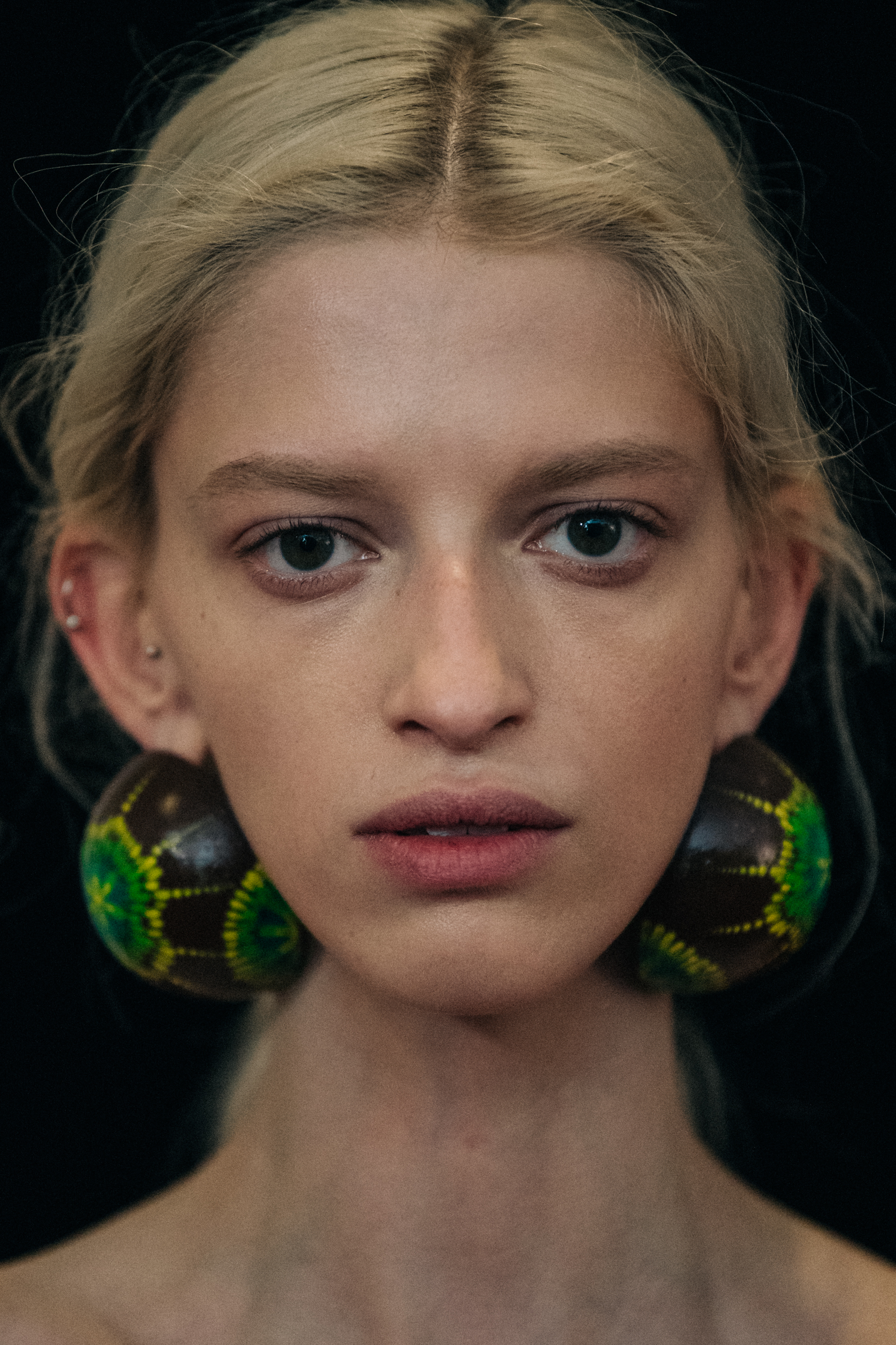 Portrait of model wearing large earrings