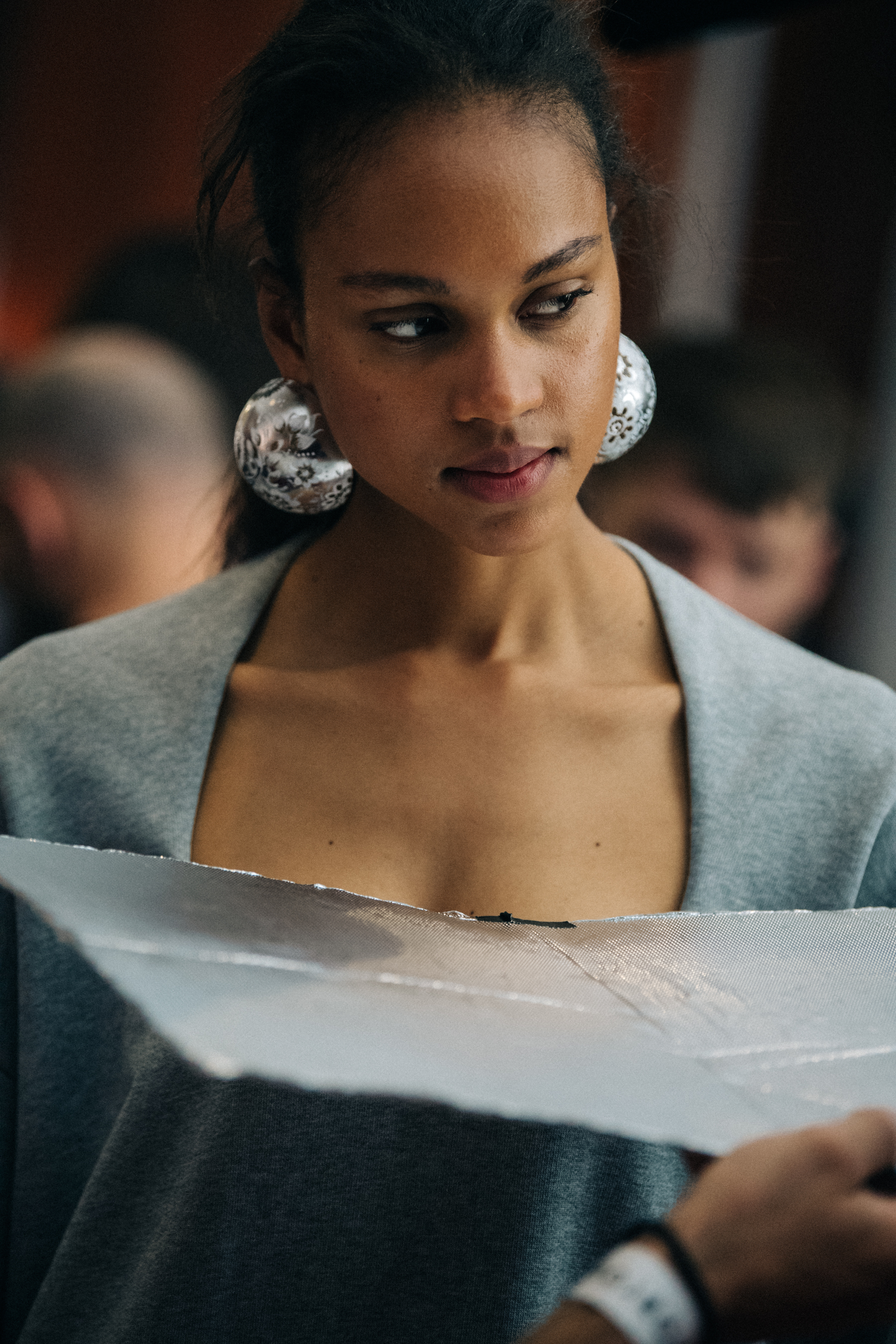 Model wearing large earrings at Y/Project