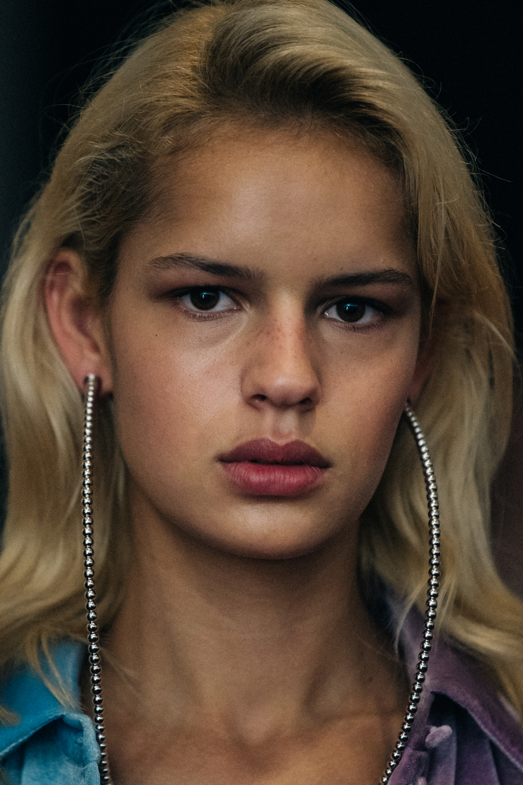 Portrait of model wearing large earrings