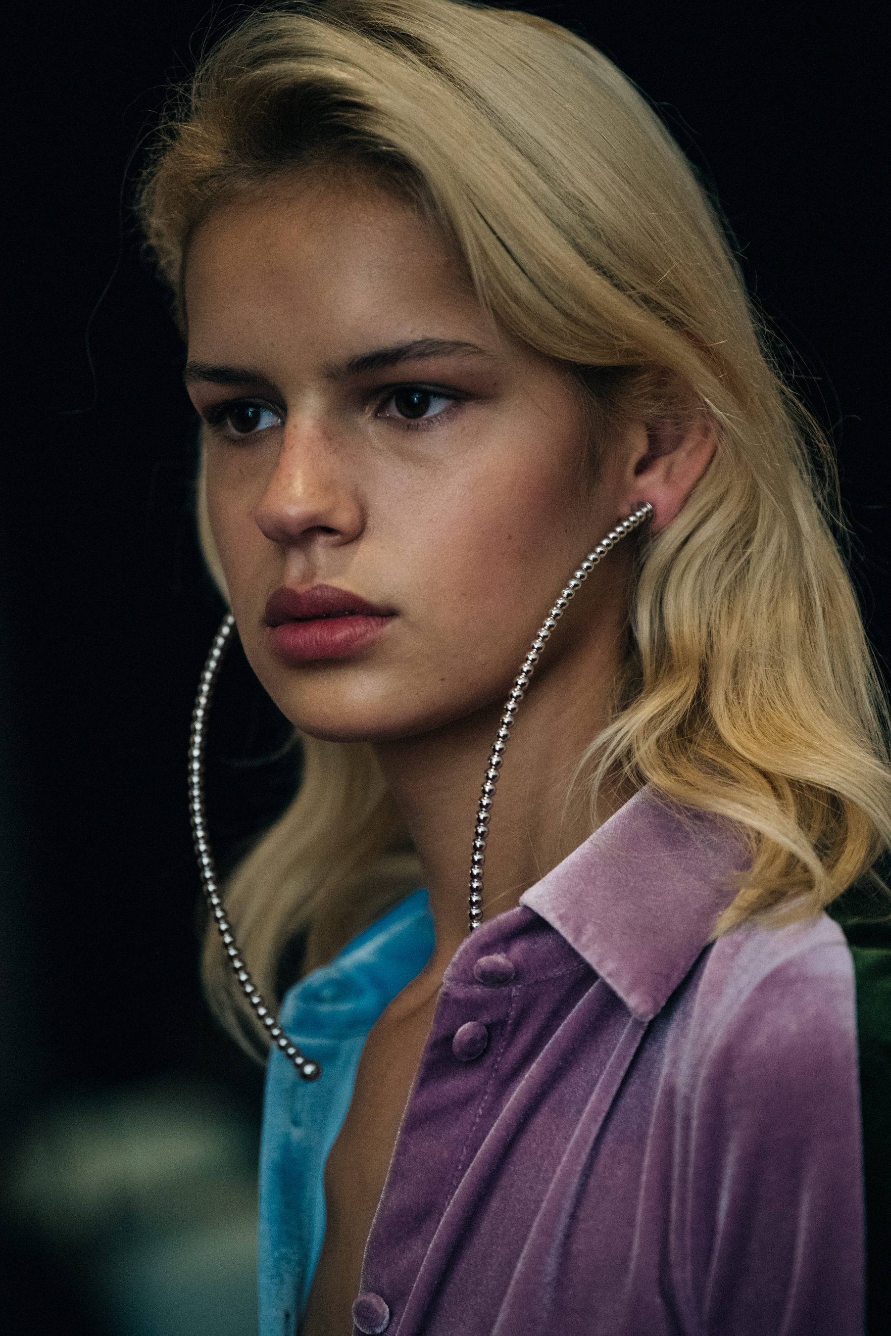 Model wearing large earrings at Y/Project