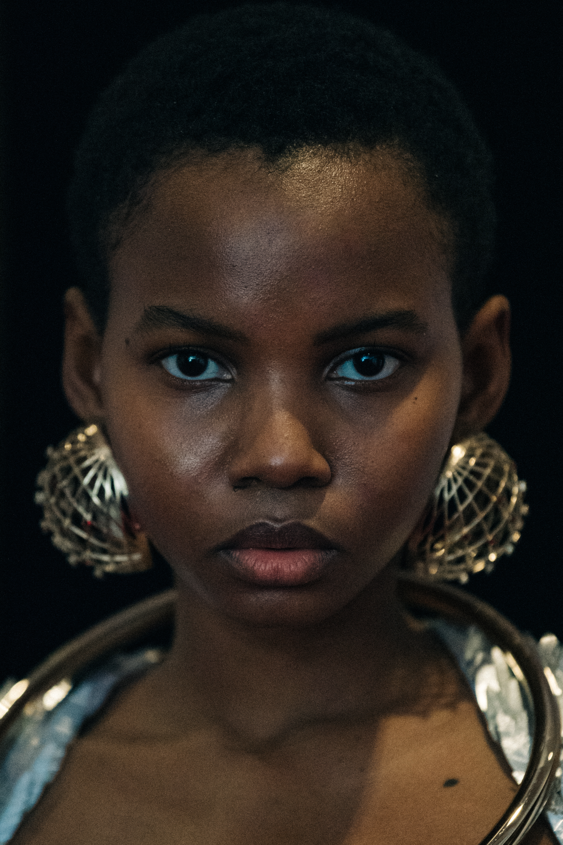 Portrait of model wearing large earrings