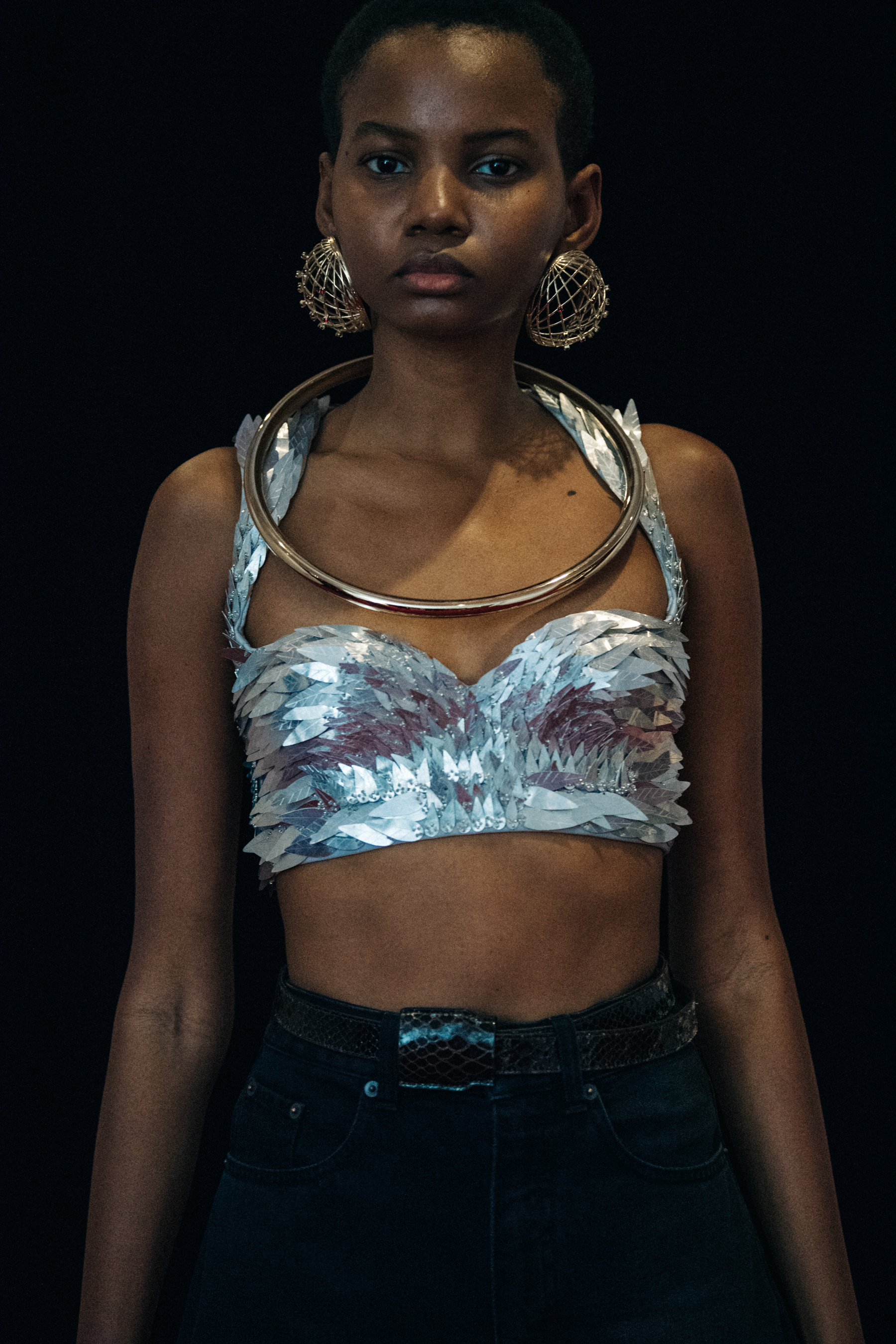Model wearing large earrings at Y/Project