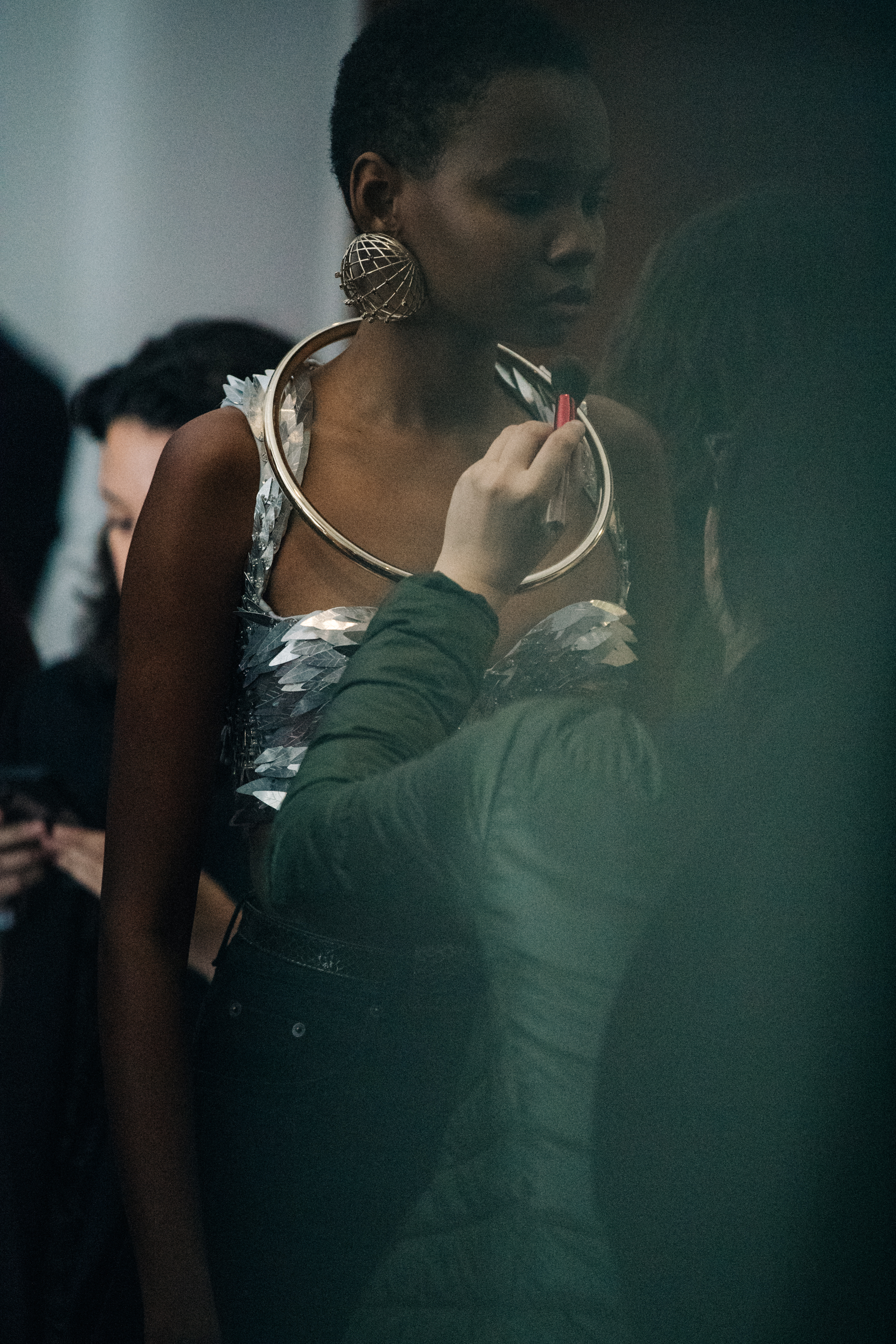 Model wearing large earrings at Y/Project