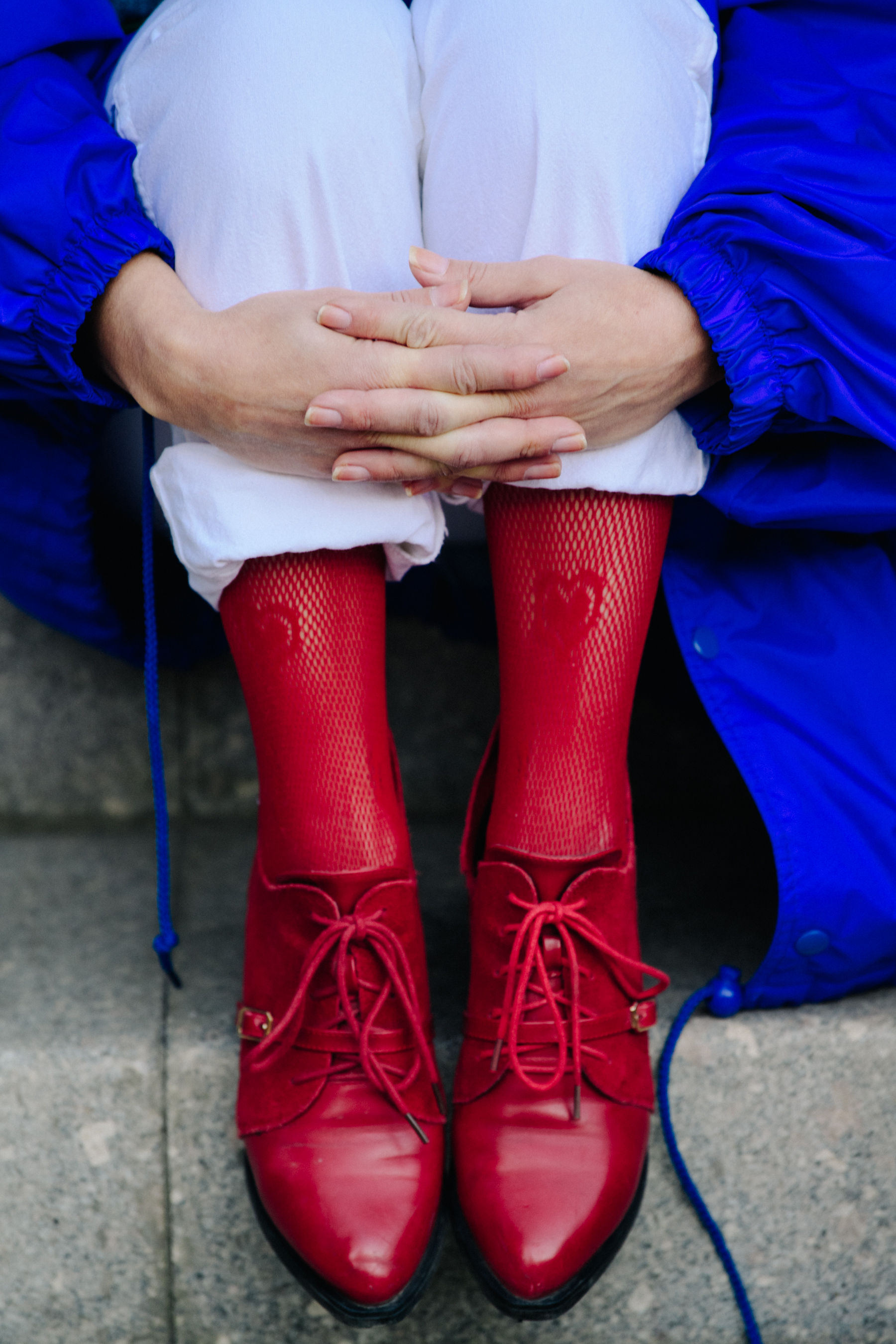 Woman wearing red shoes