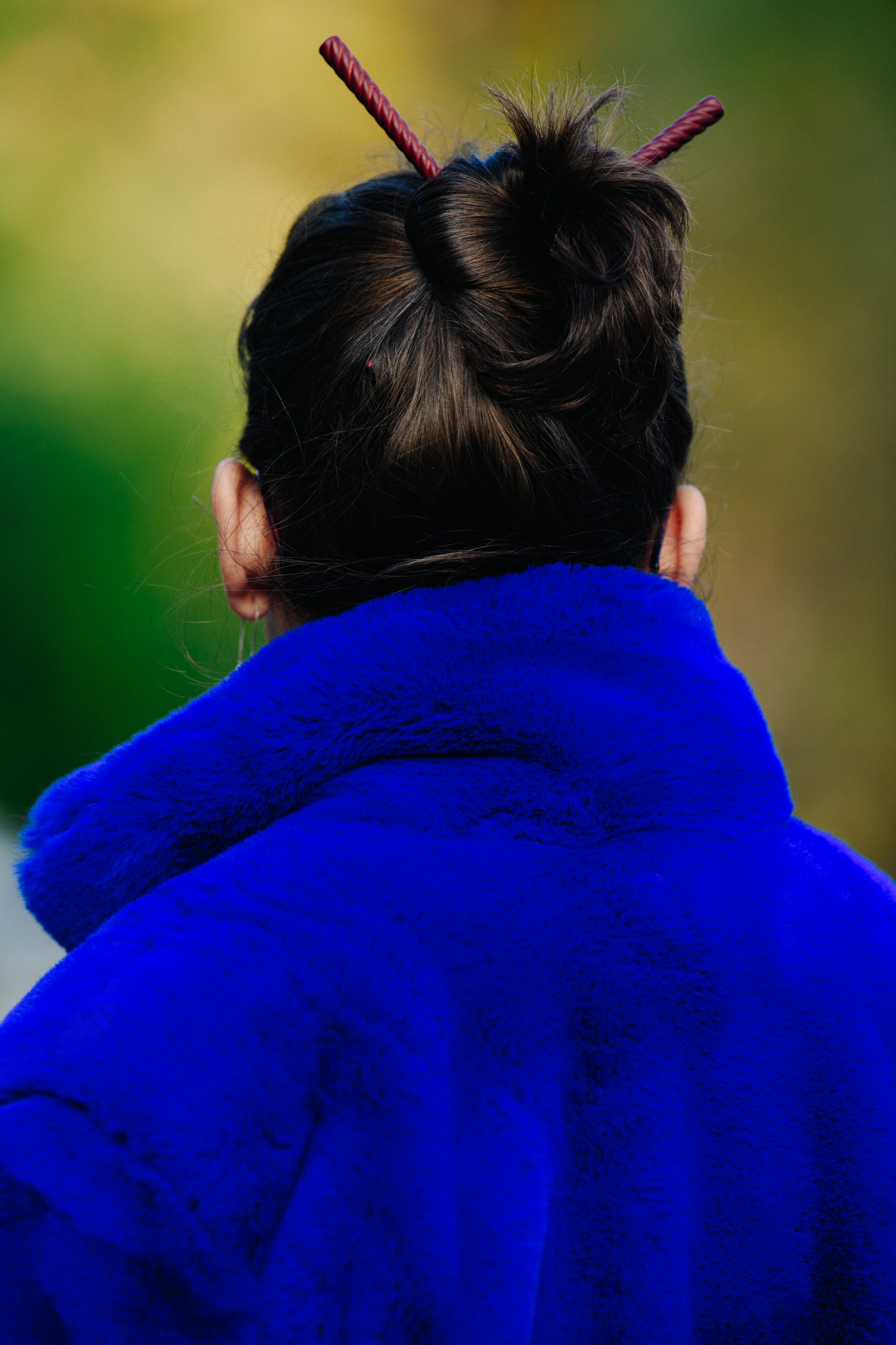 Woman wearing blue fur coat