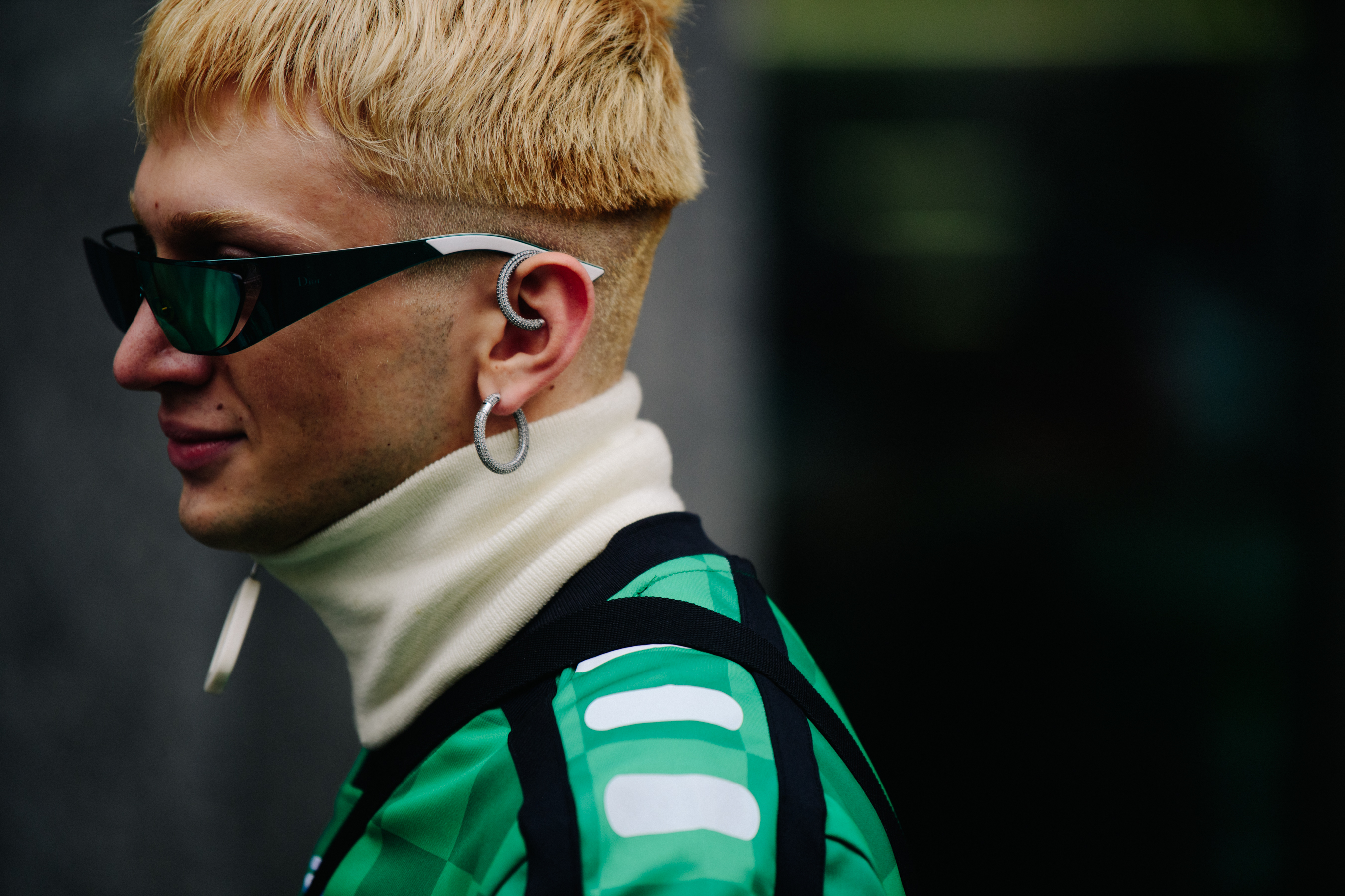 Man wearing green football shirt
