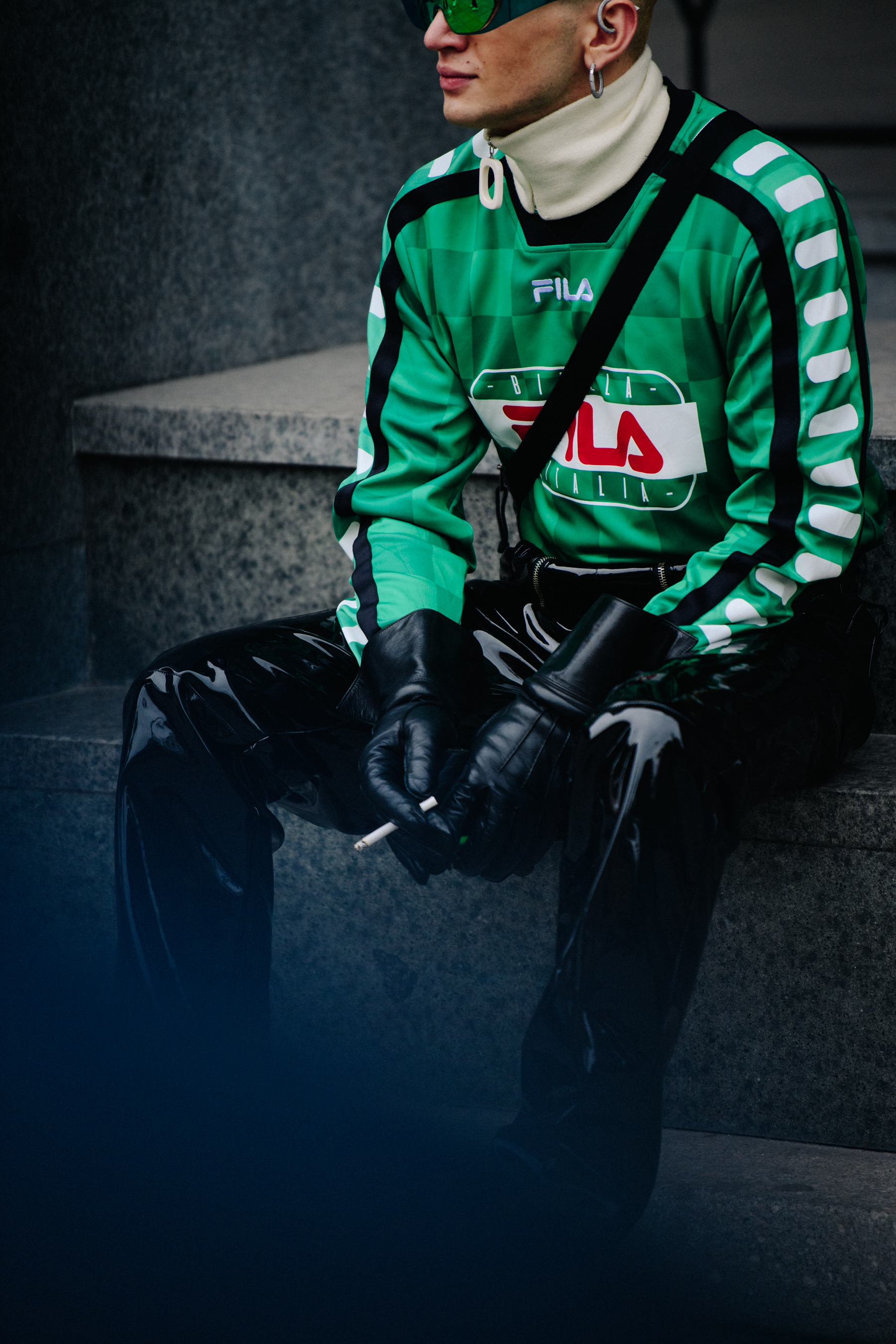 Man wearing green football shirt