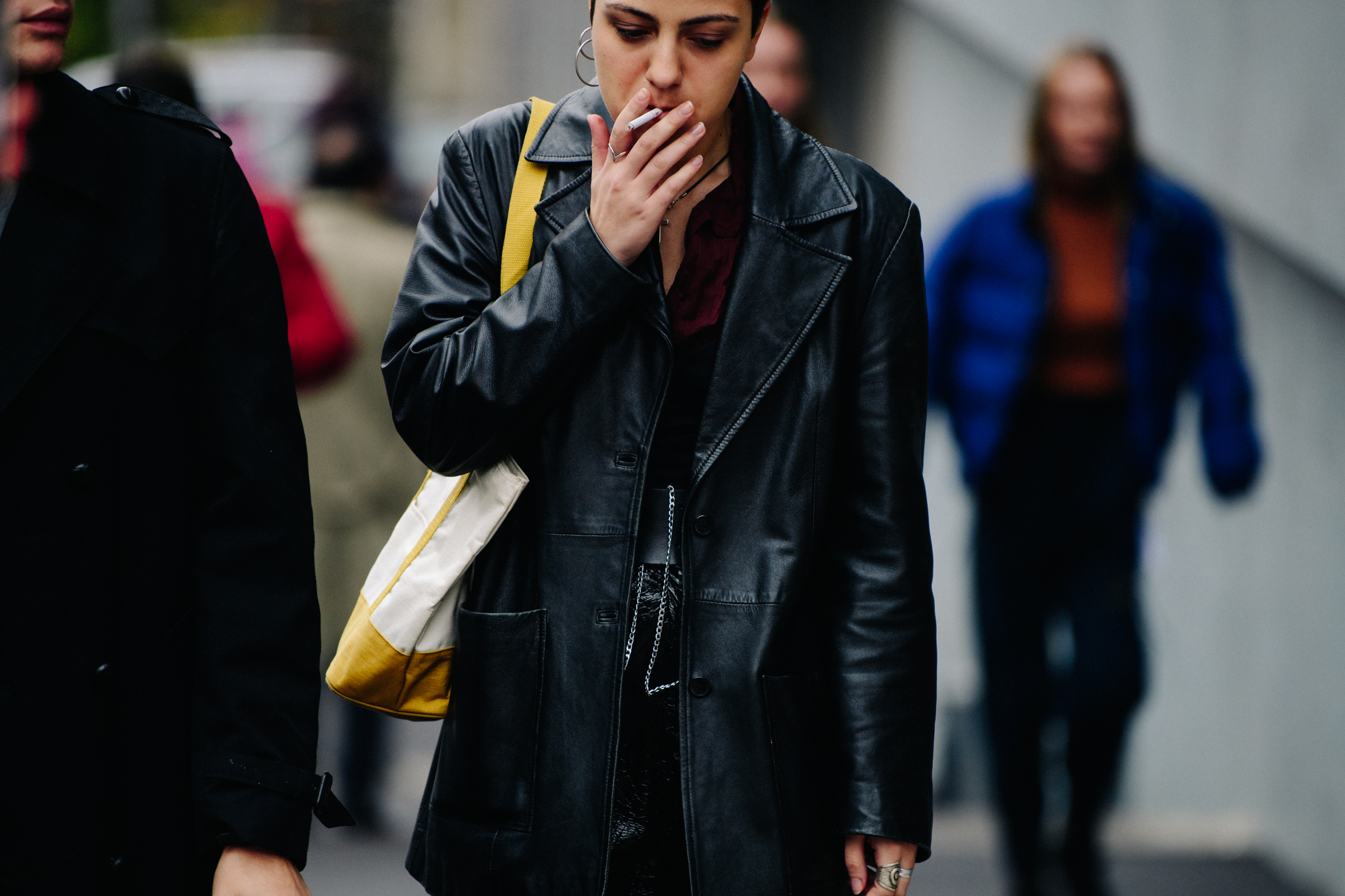 Woman wearing long leather coat