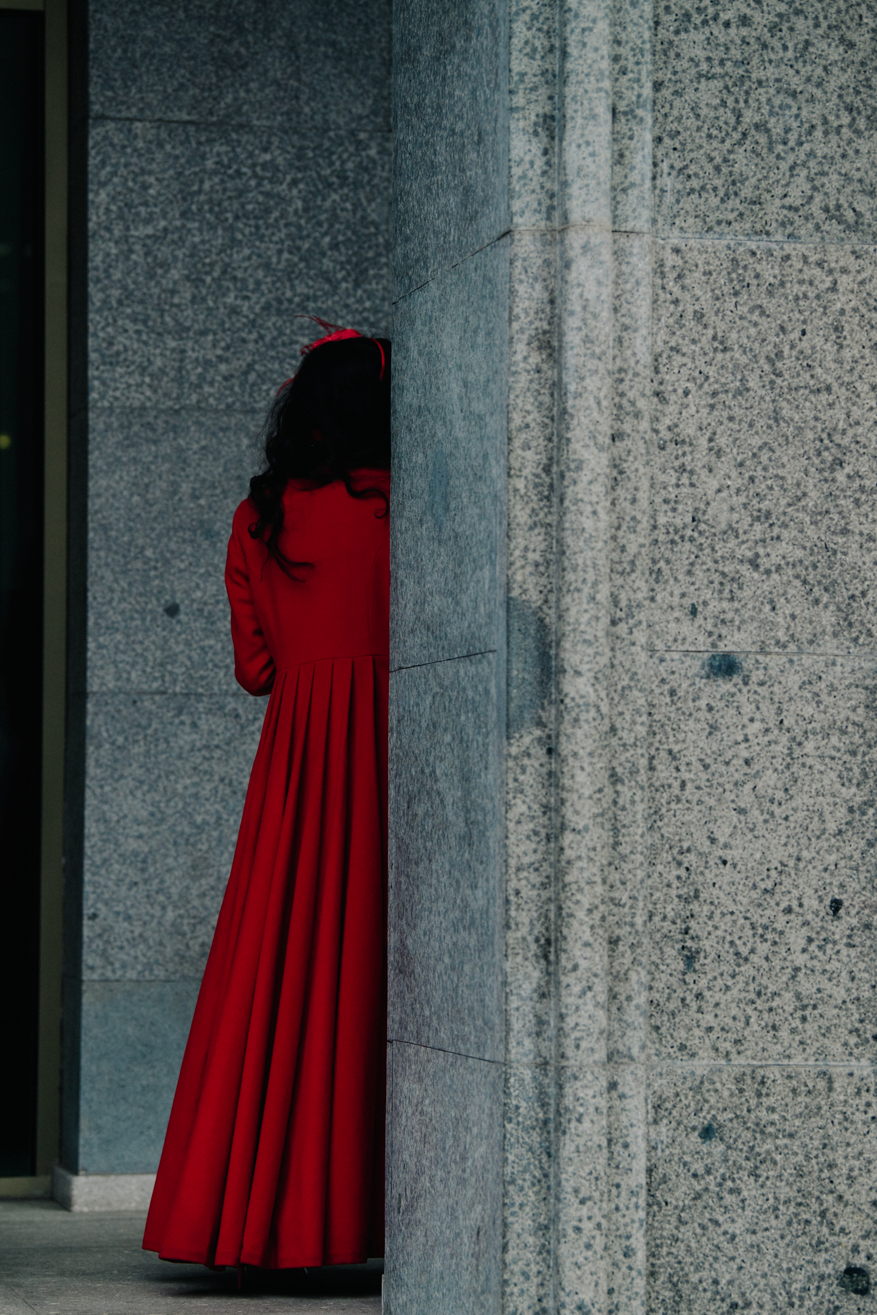 Woman wearing long red coat