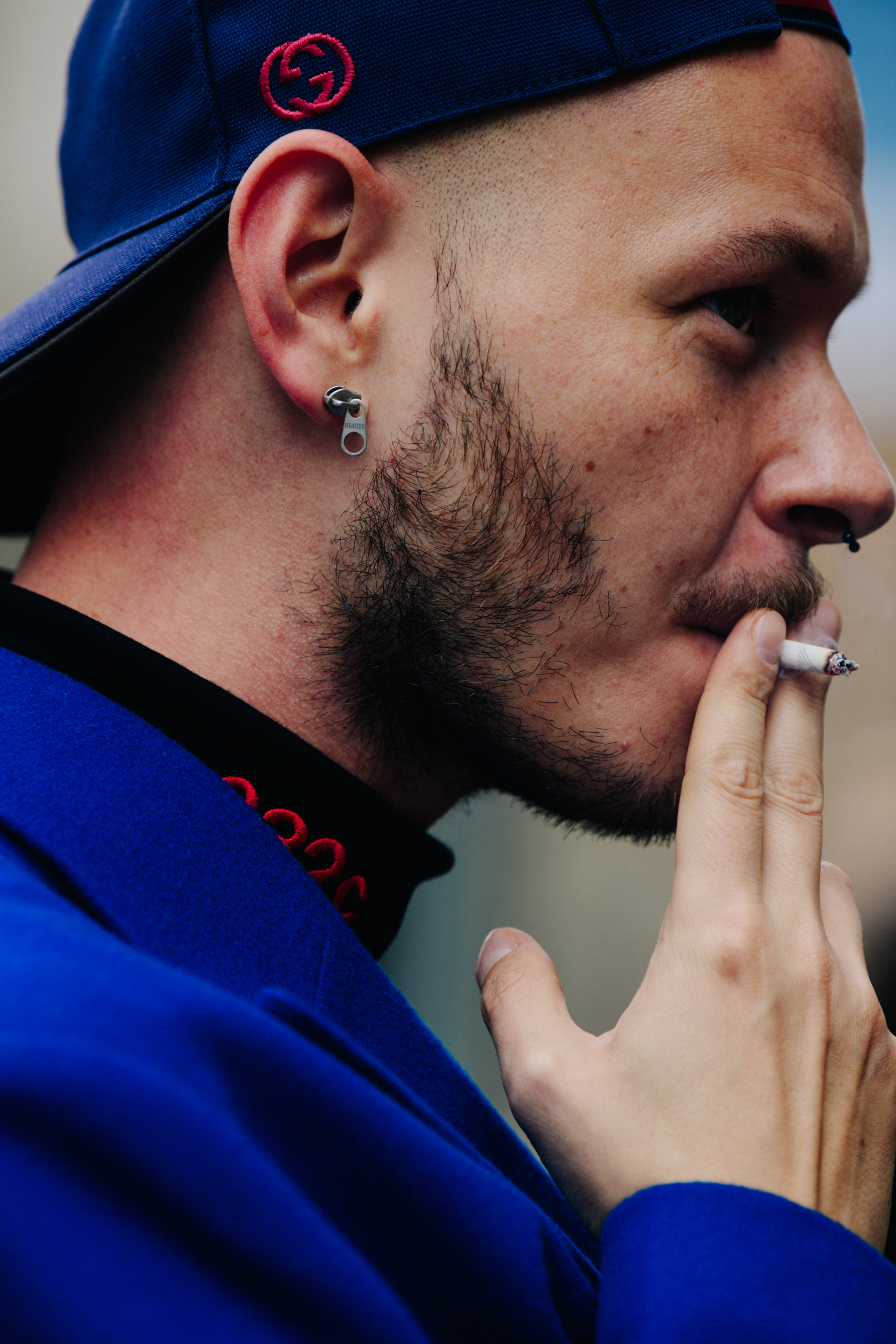 Man wearing blue Gucci cap