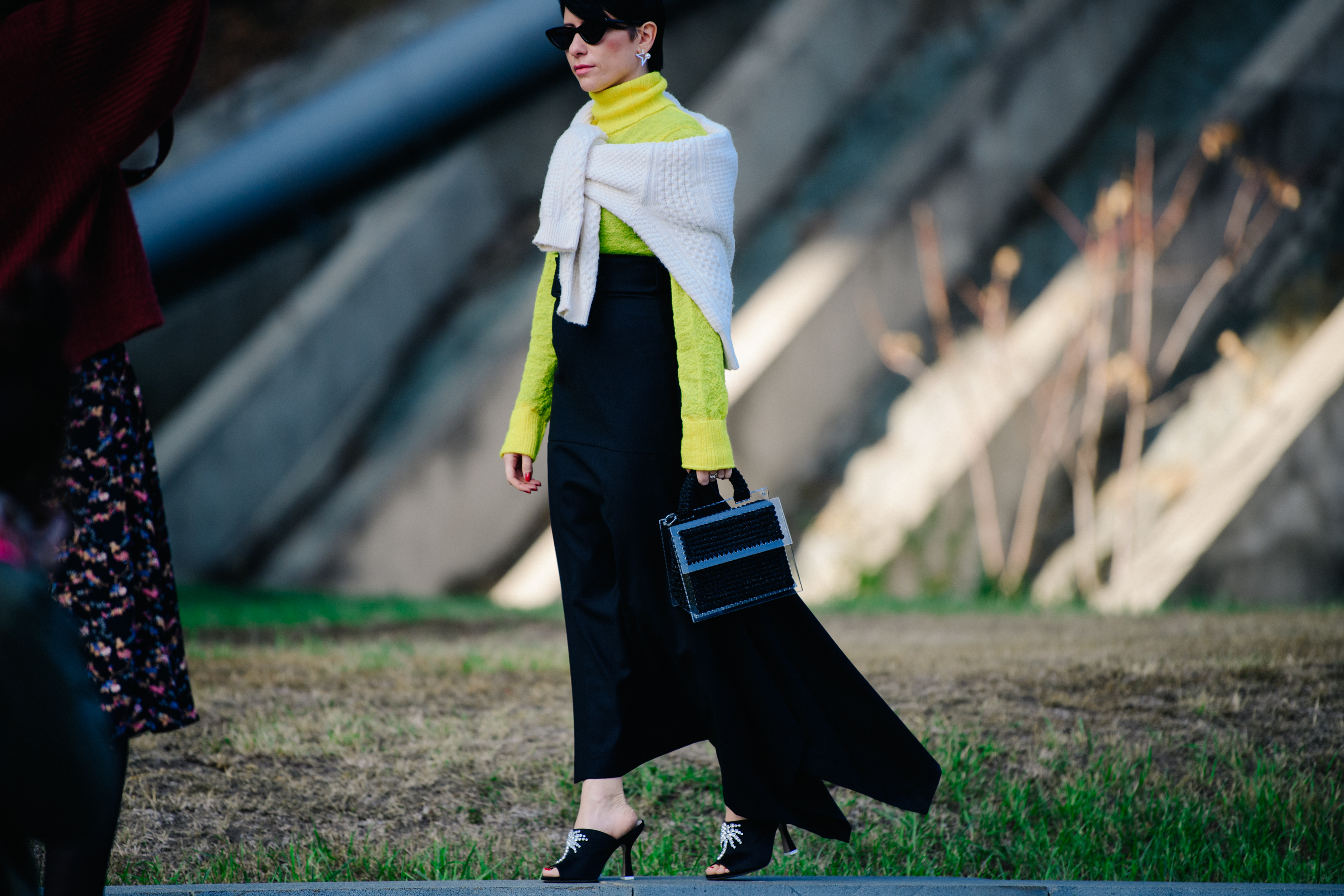 Woman wearing yellow jumper