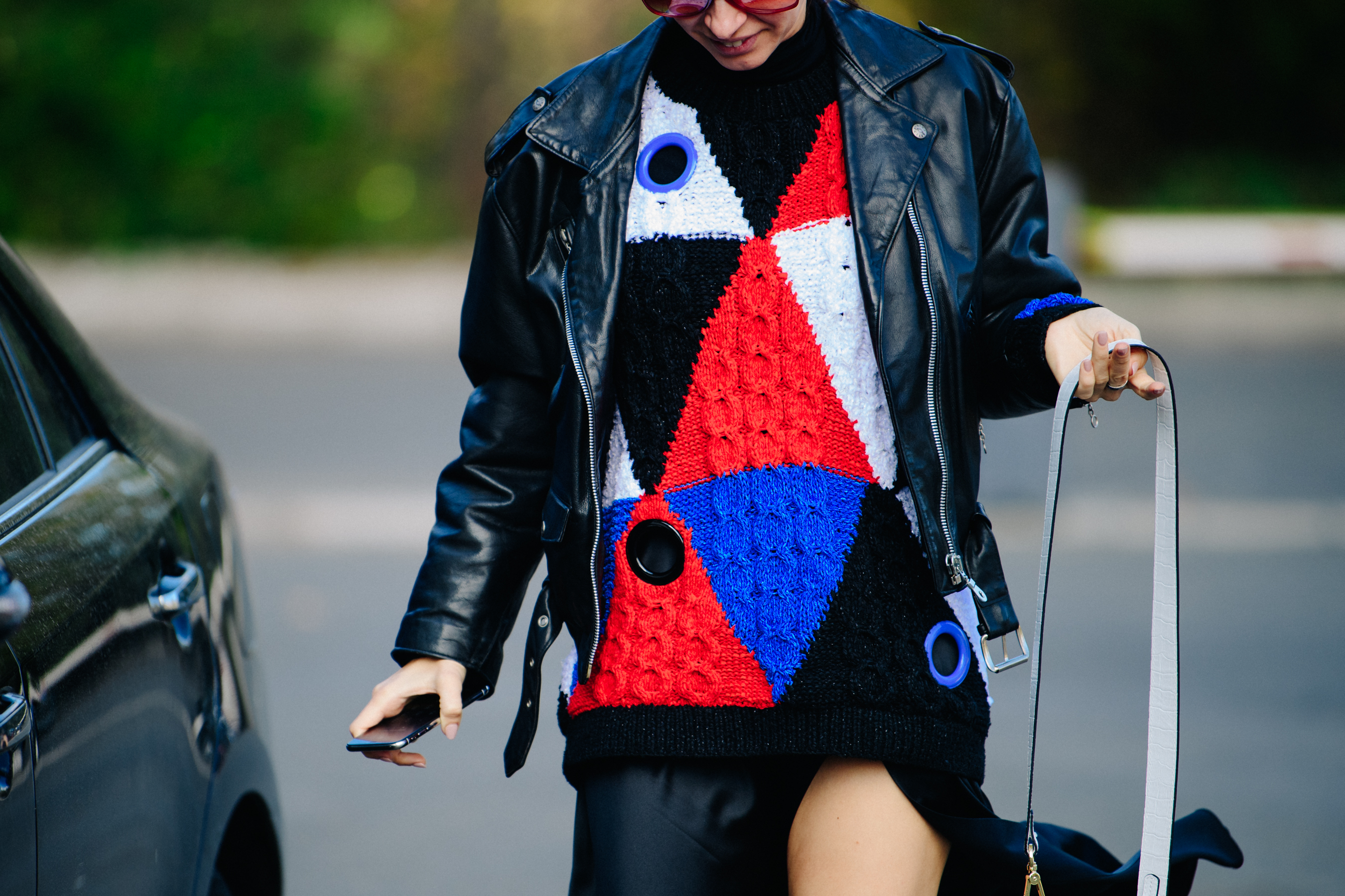 Woman wearing colourful jumper