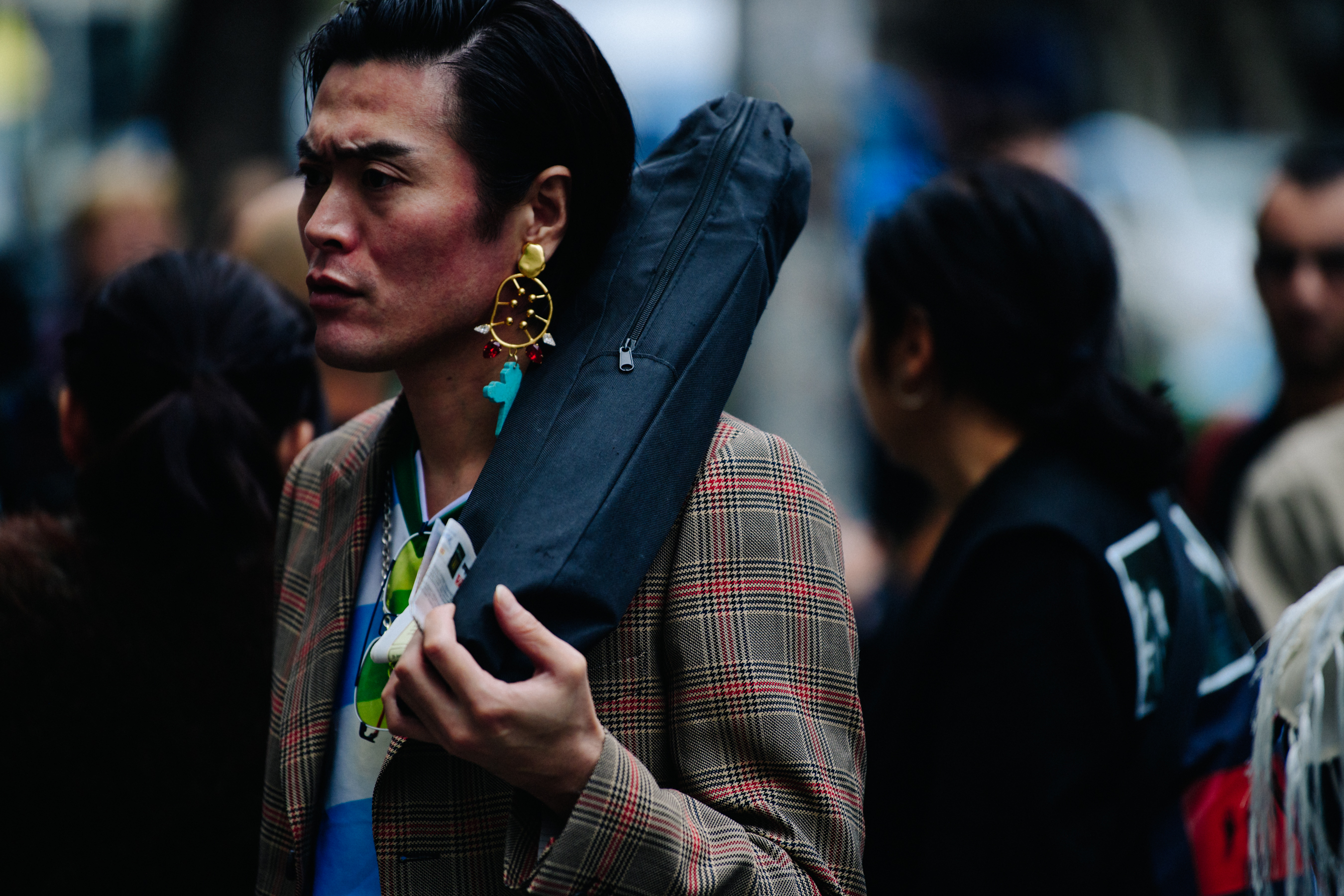 Japanese man carrying tripod