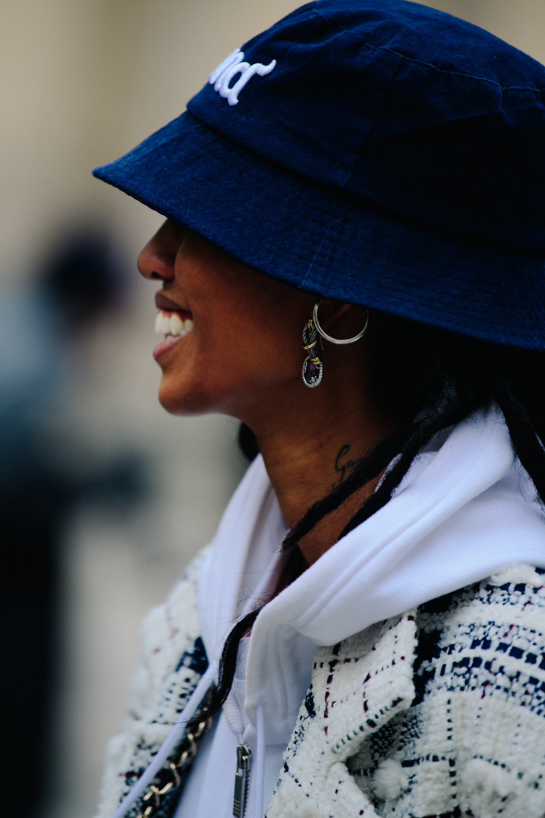 Model wearing blue bucket hat