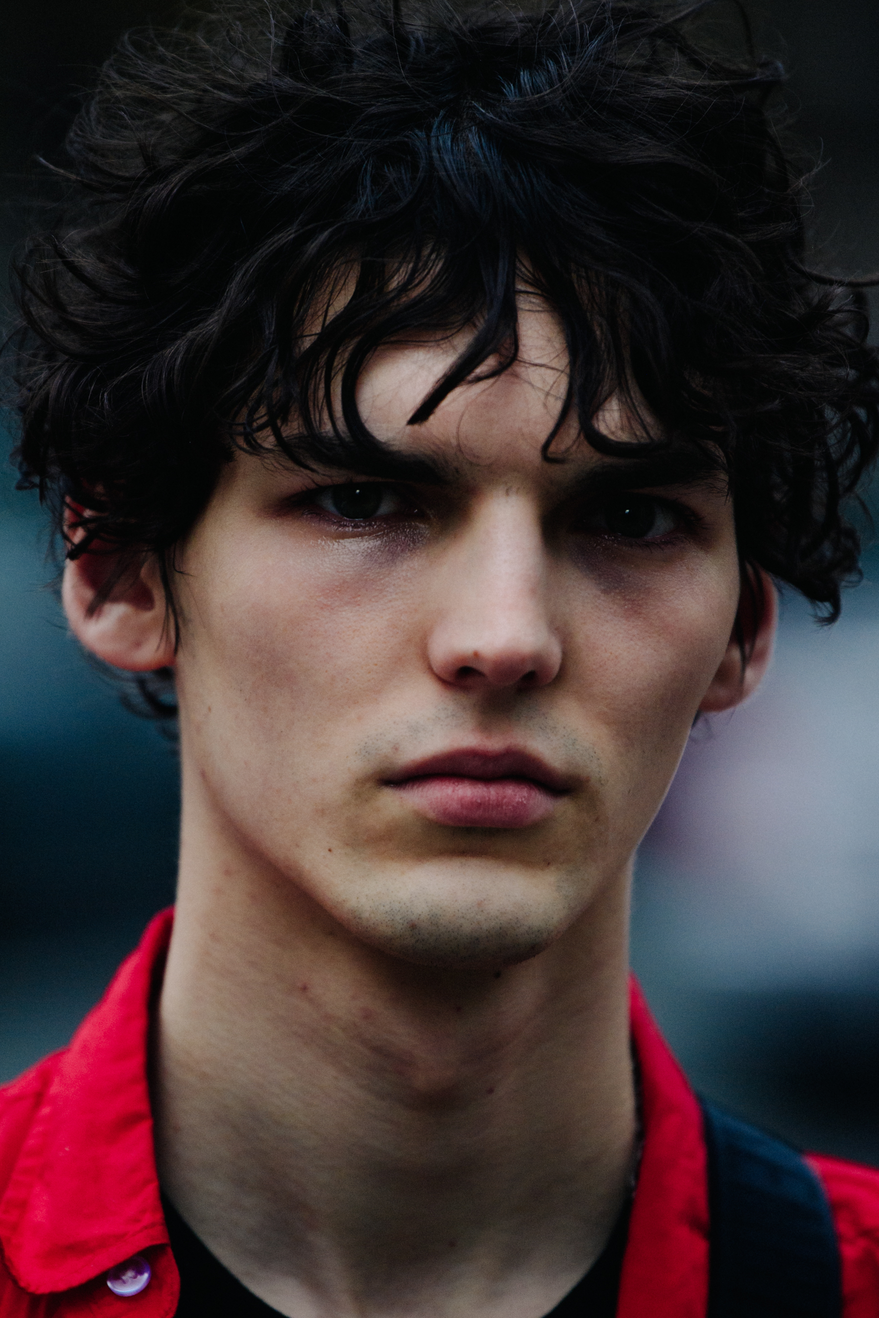 Portrait of model with dark curly hair