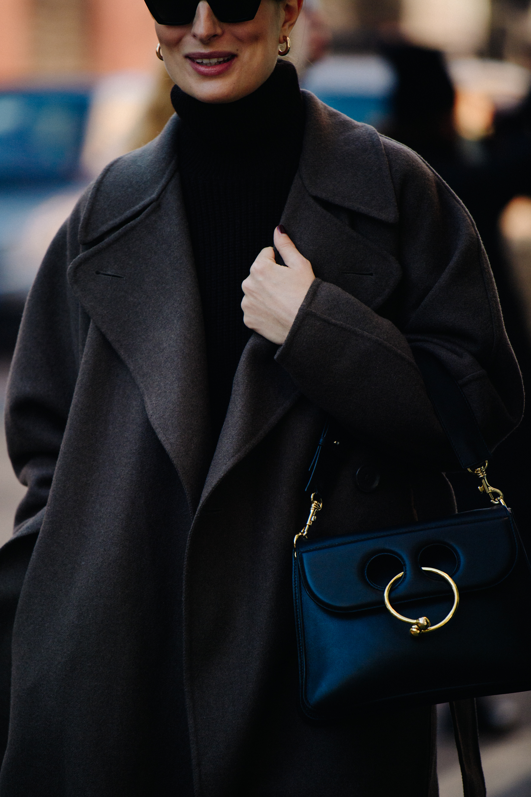 Woman carrying JW Anderson bag
