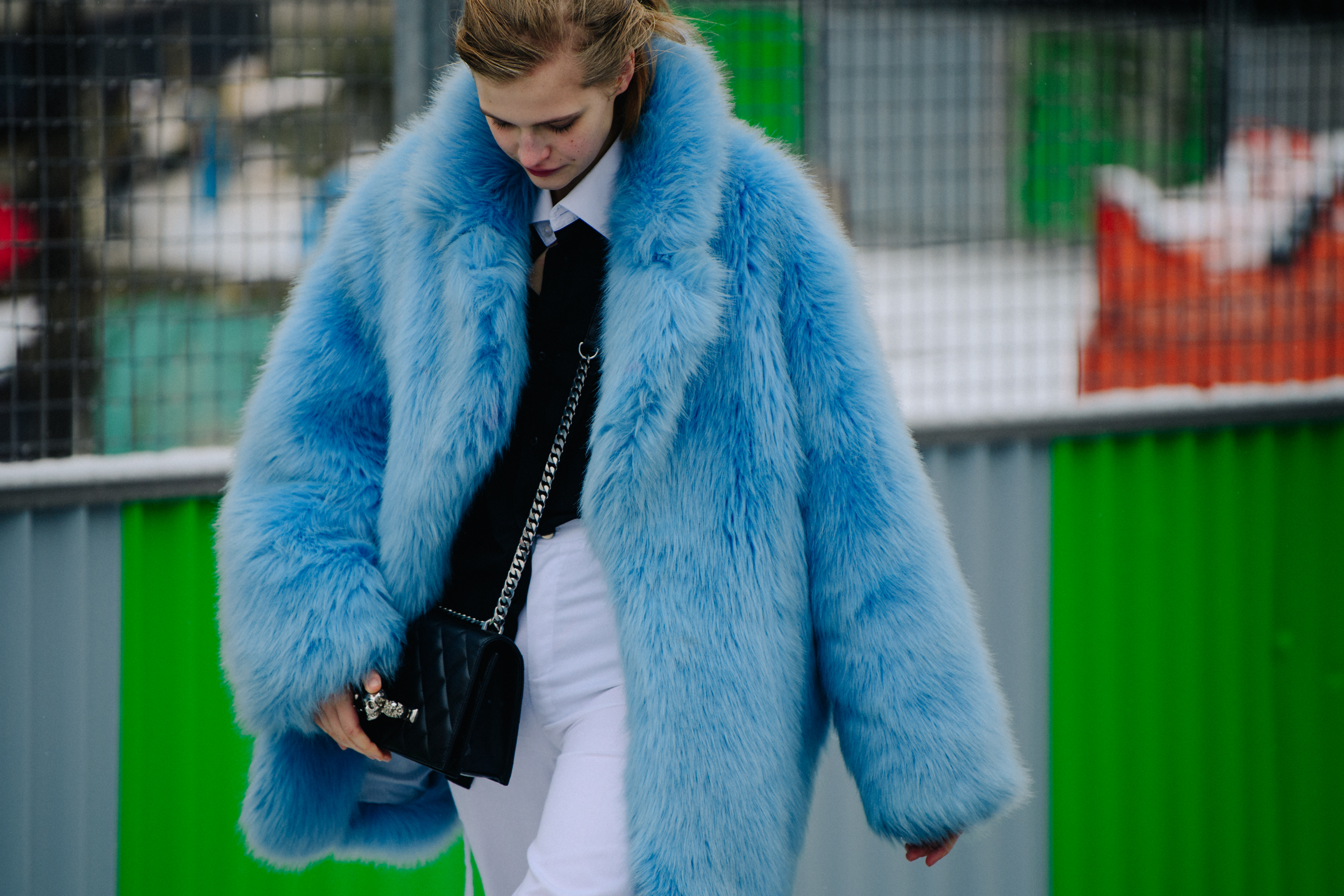 Woman wearing blue fur coat