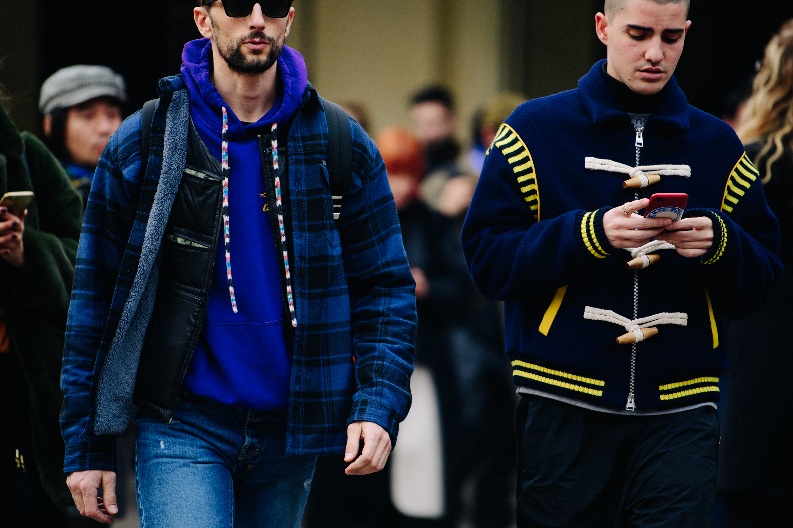 Two men wearing blue