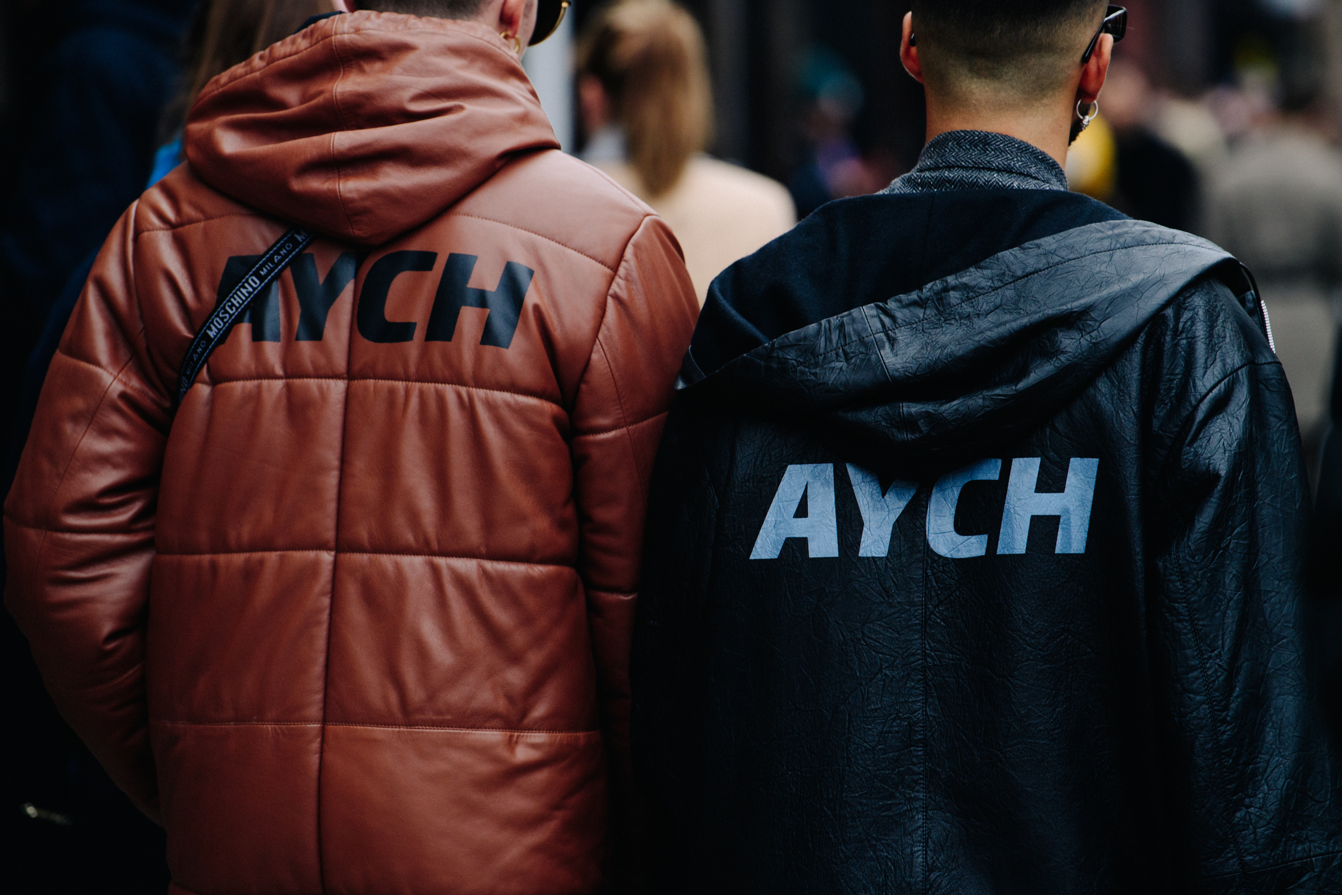 Men wearing matching coats