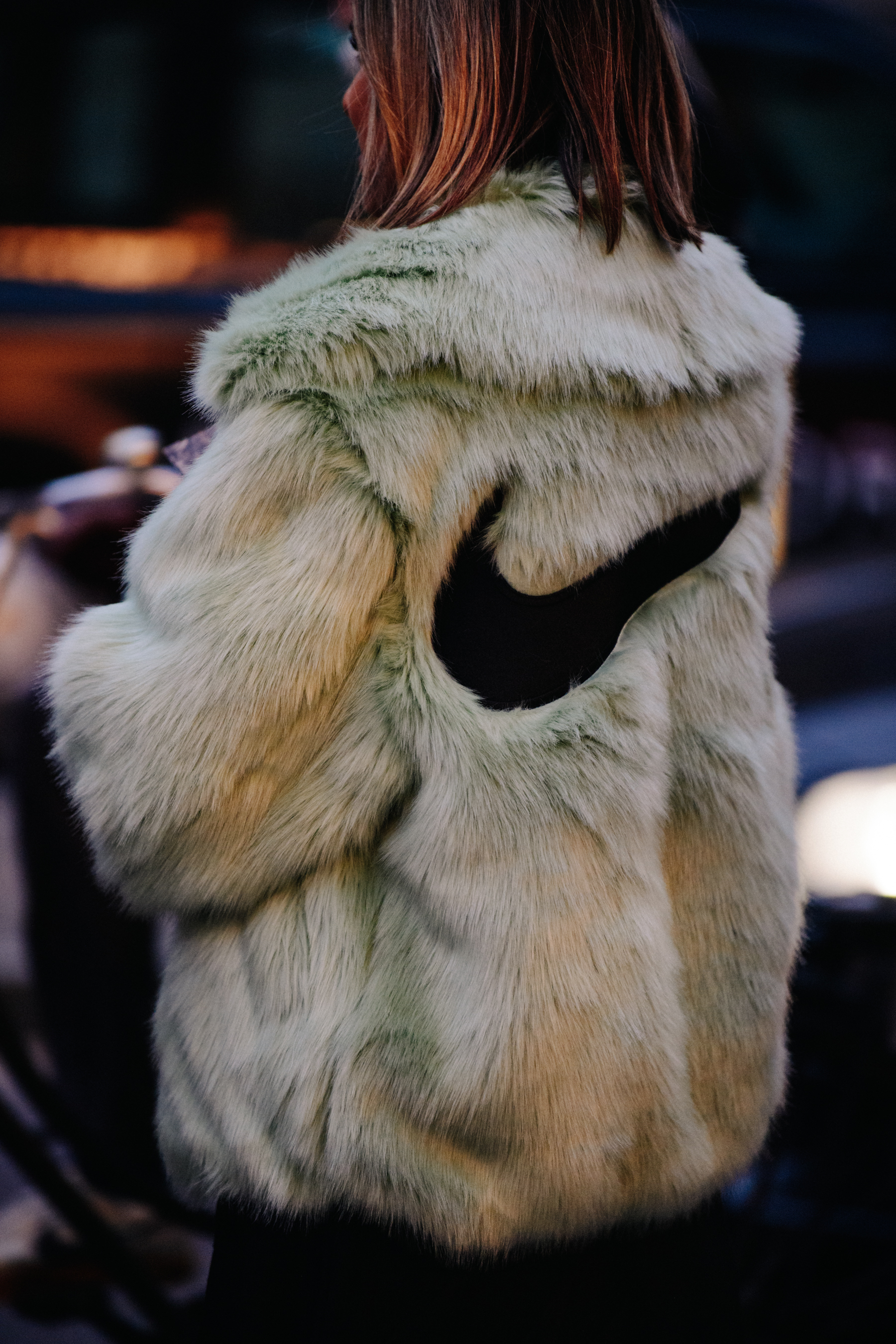 Woman wearing fur Nike jacket