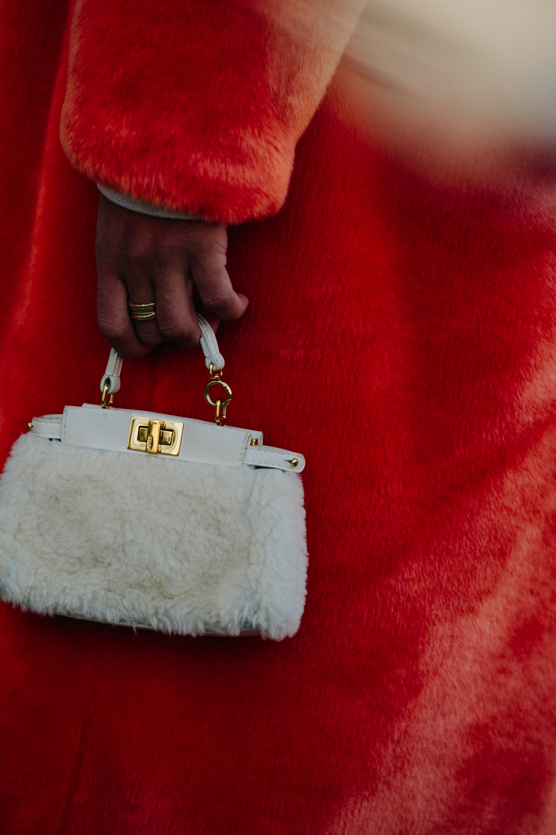 Woman wearing red fur coat