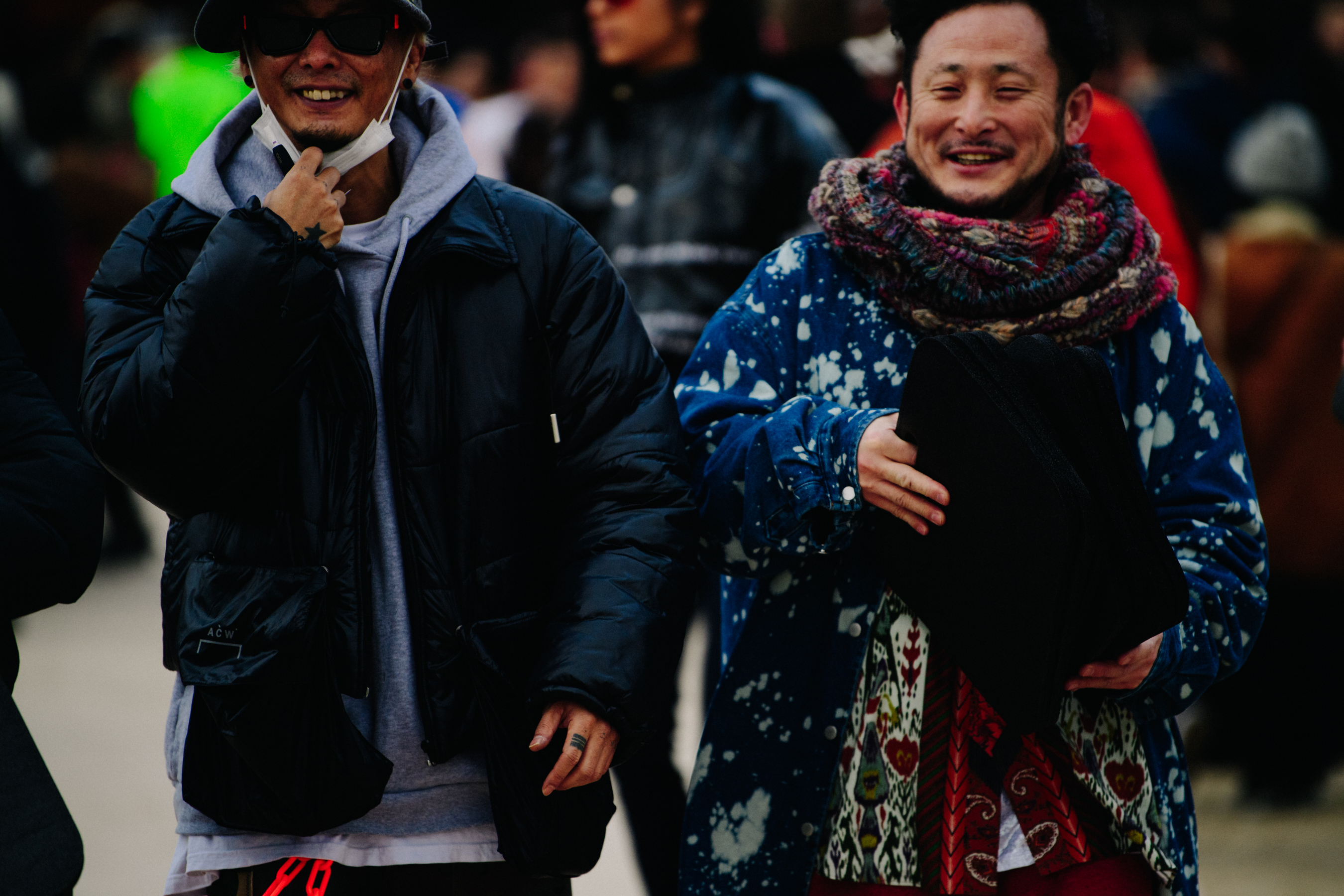 Two Asian men wearing cool clothing