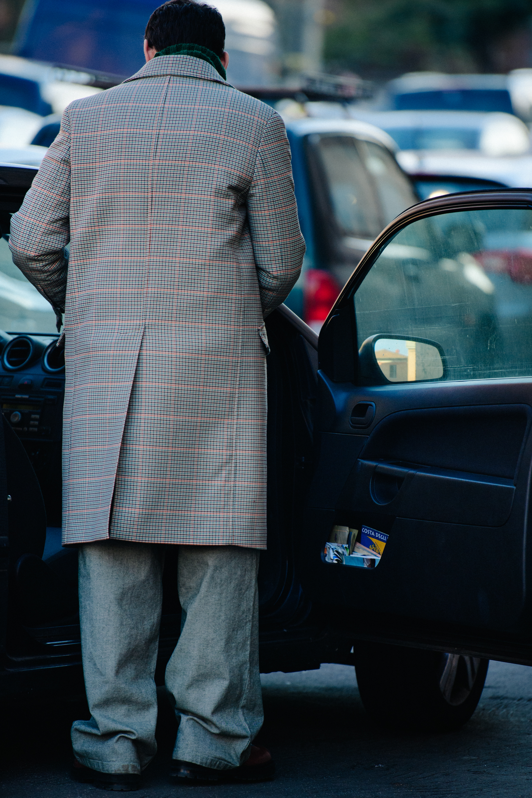Man wearing grey check coat