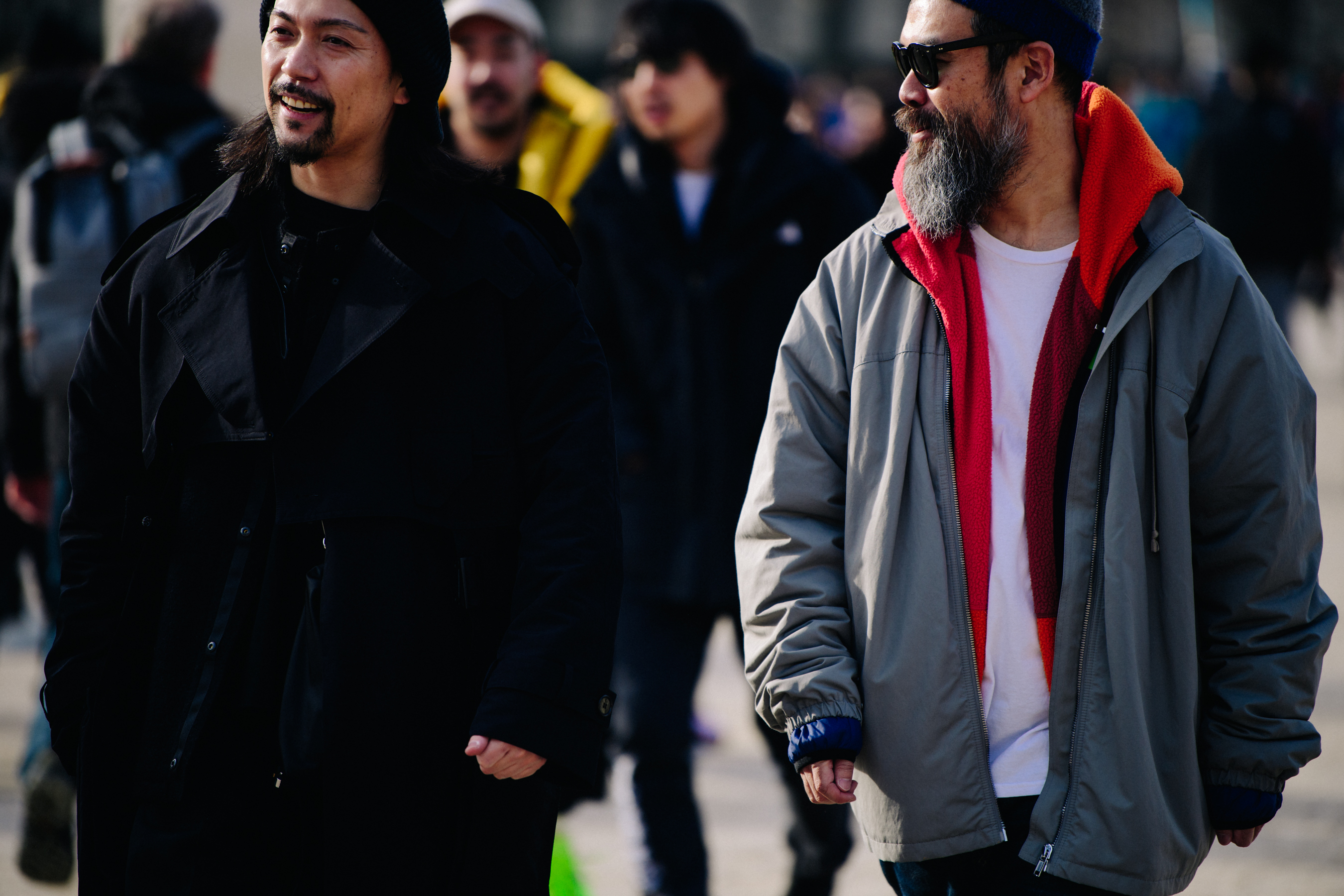 Two men wearing beanies