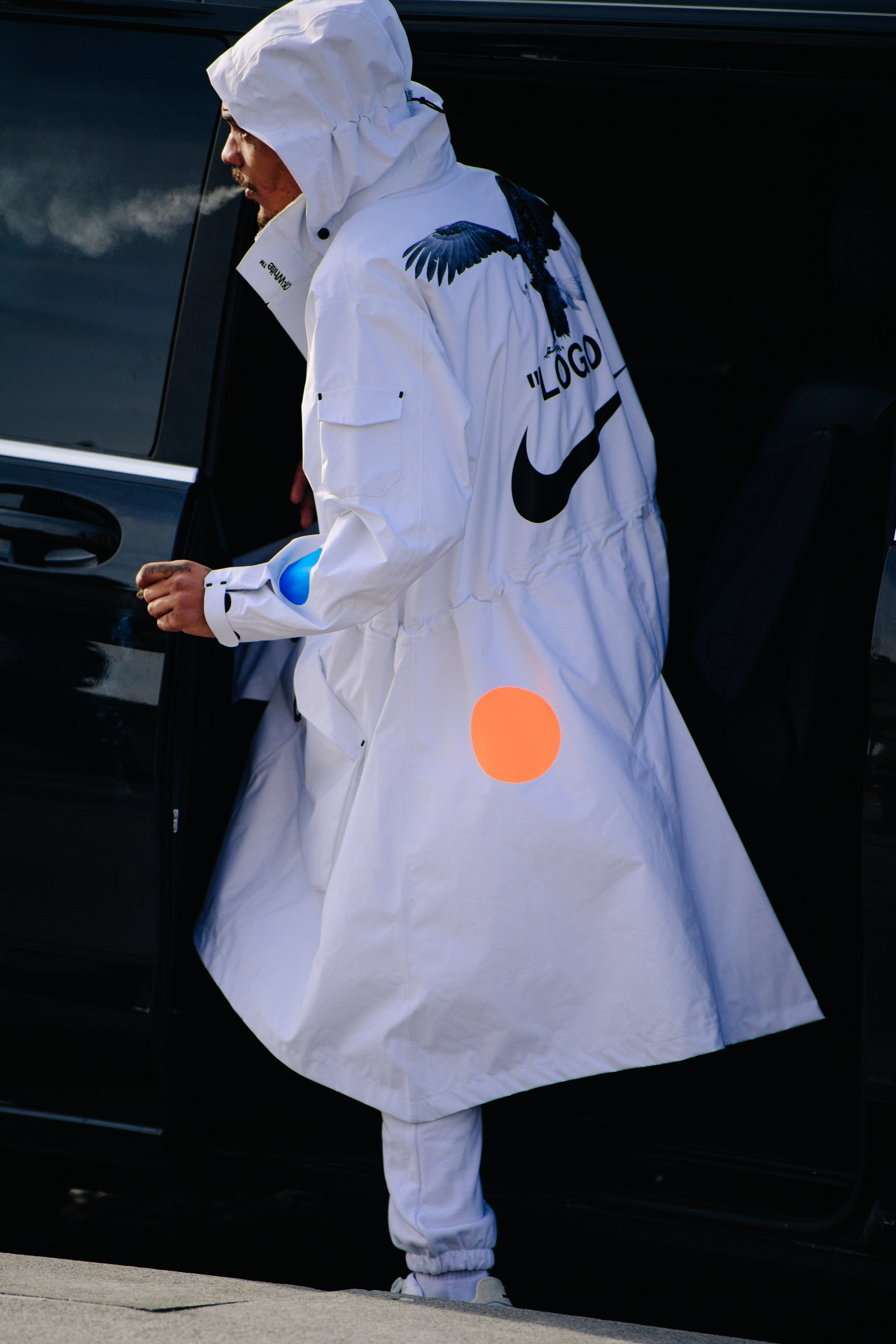 Man wearing white Nike coat
